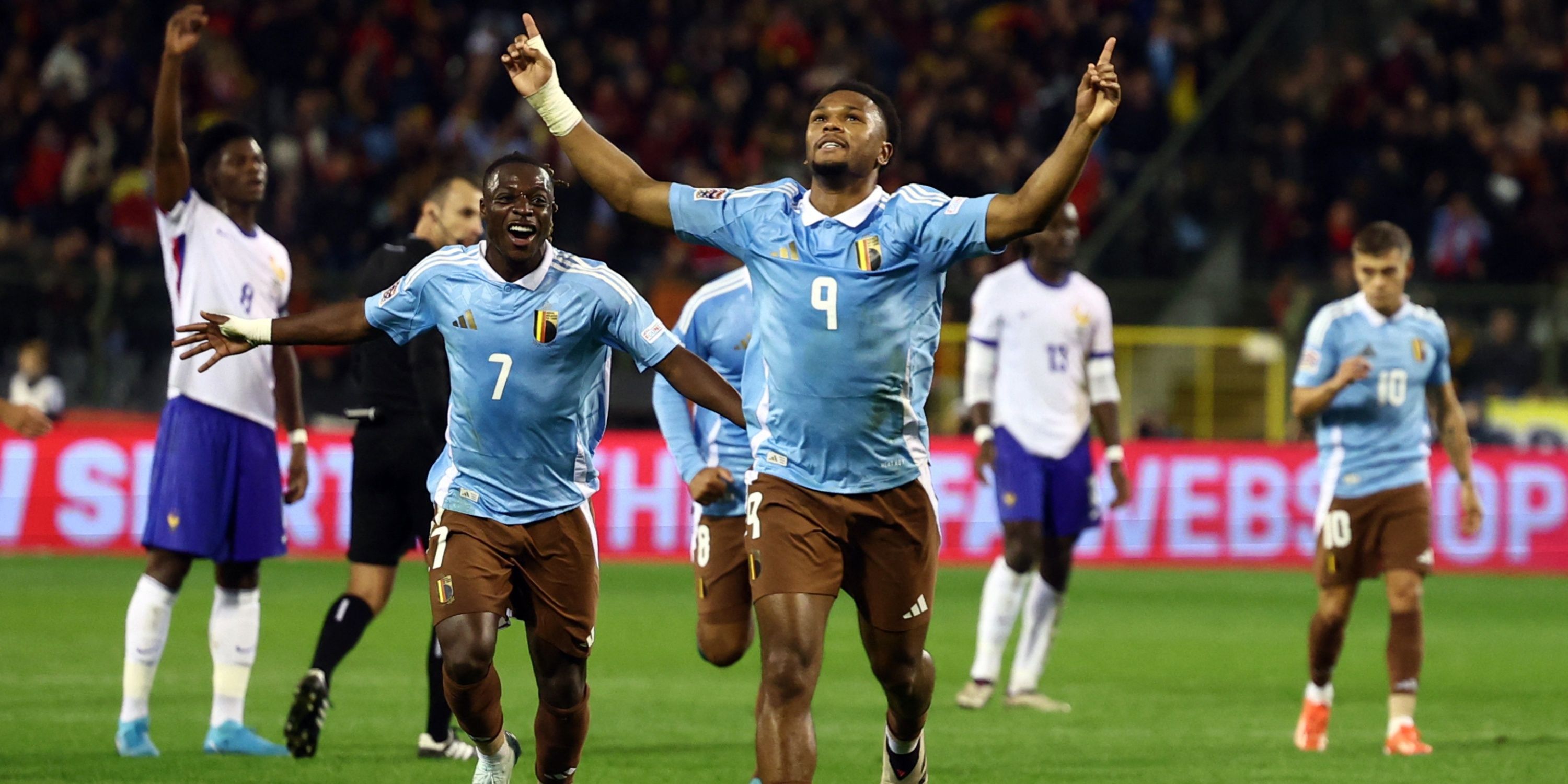 Lois Openda celebrates a goal against France.