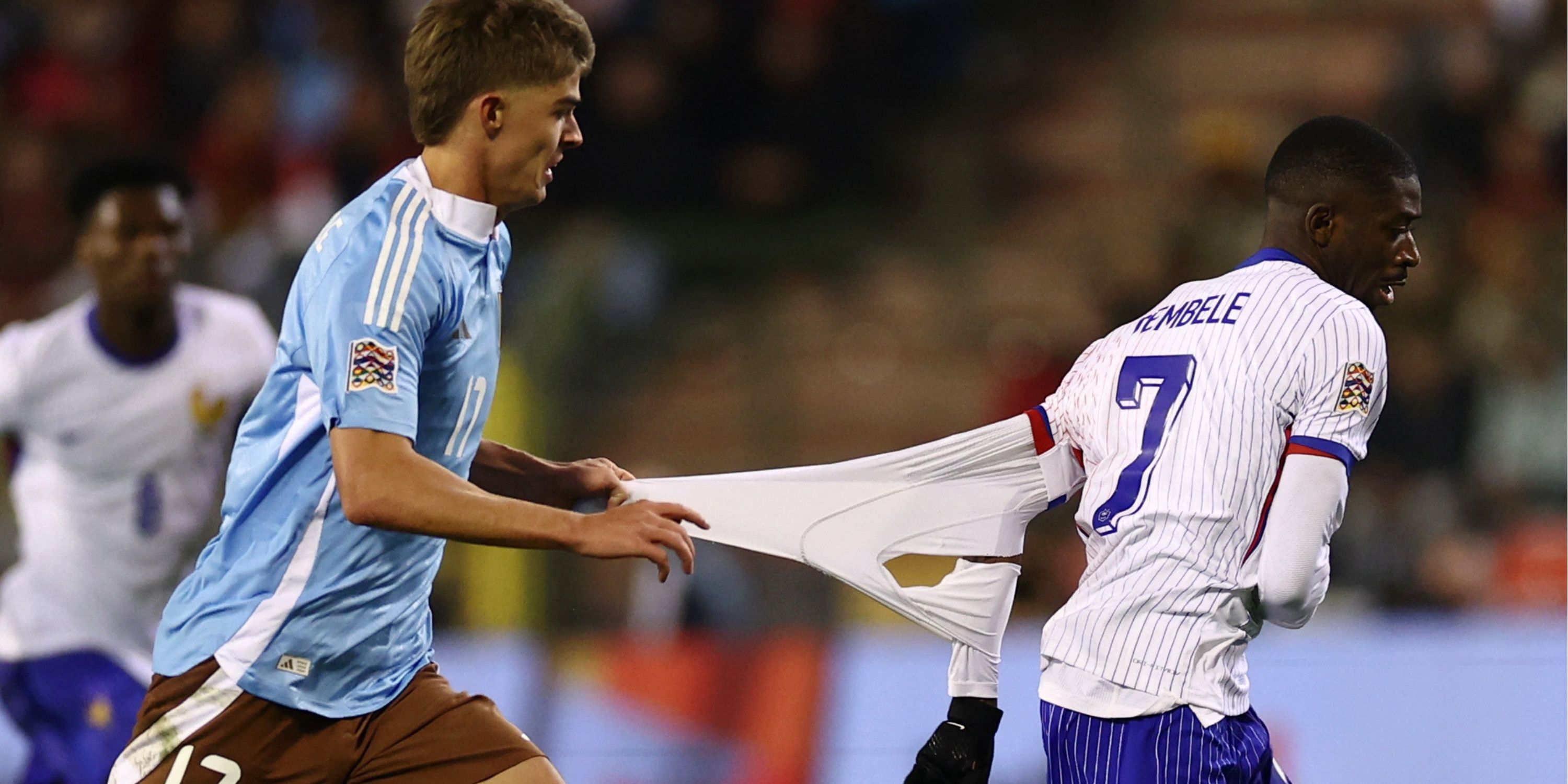 Ousmane Dembélé gets his shirt pulled.