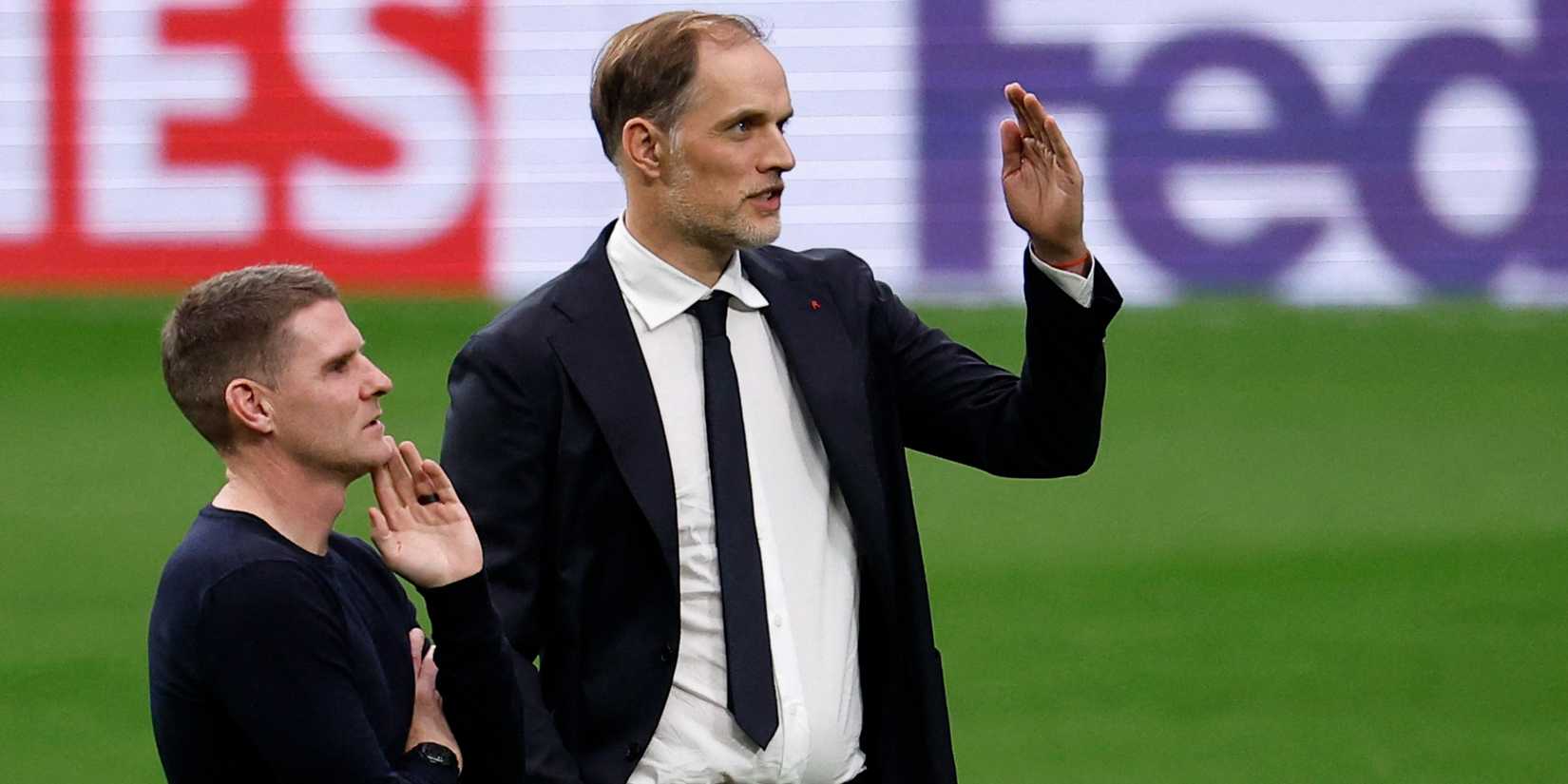 Chelsea's Anthony Barry and Thomas Tuchel discussing tactics.