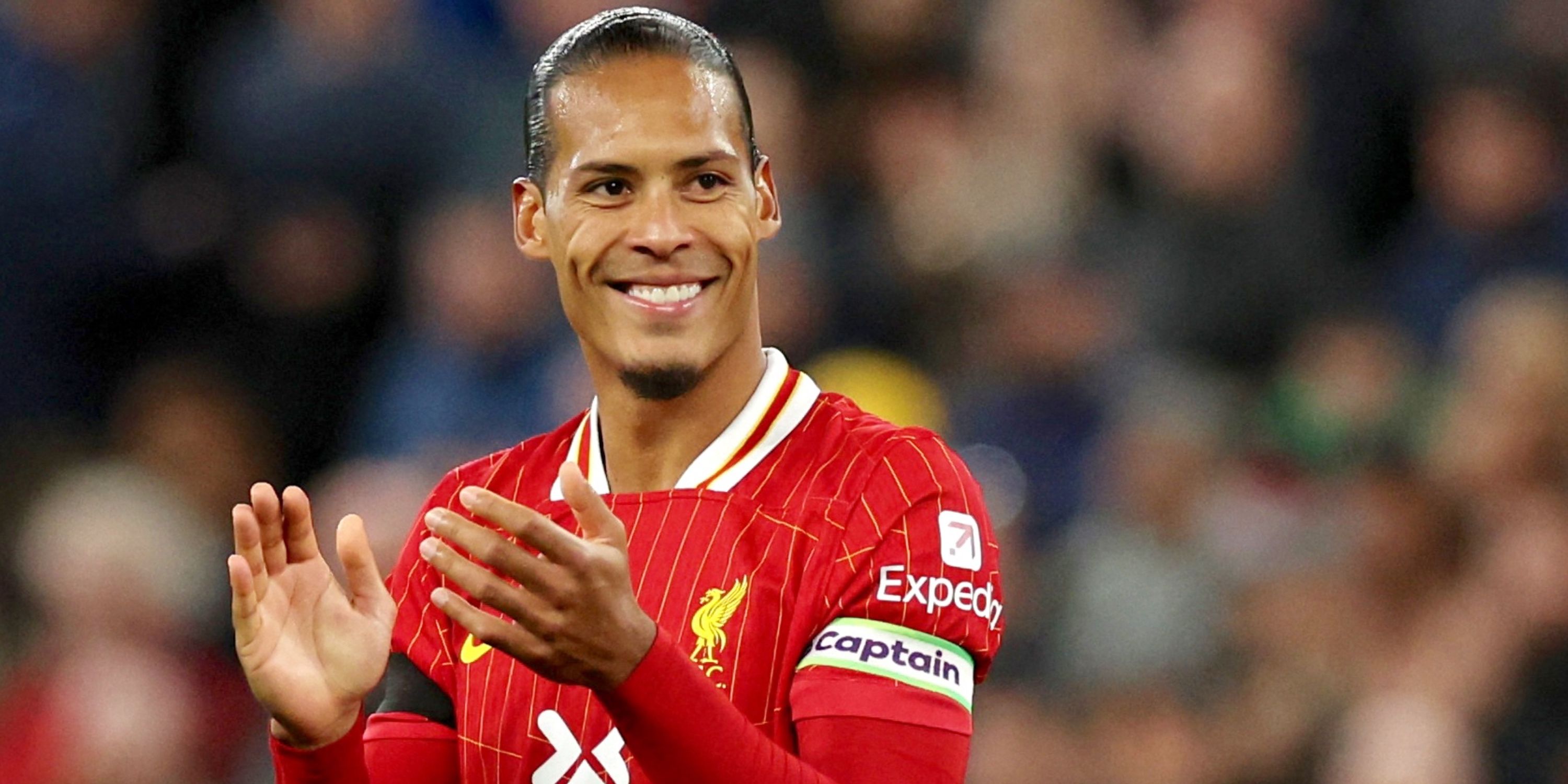 Liverpool captain Virgil van Dijk applauding supporters