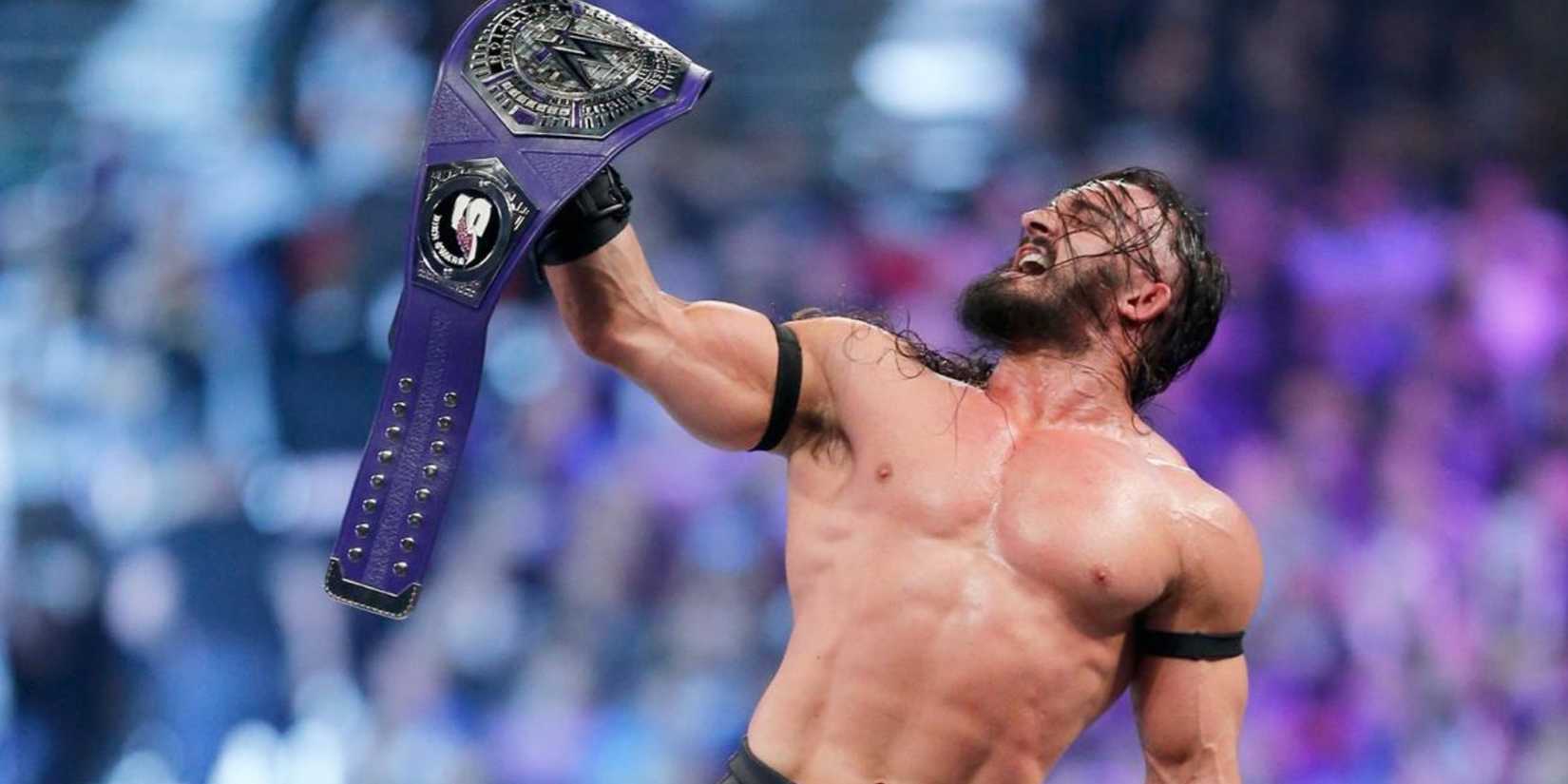 Neville raising the WWE Cruiserweight Championship