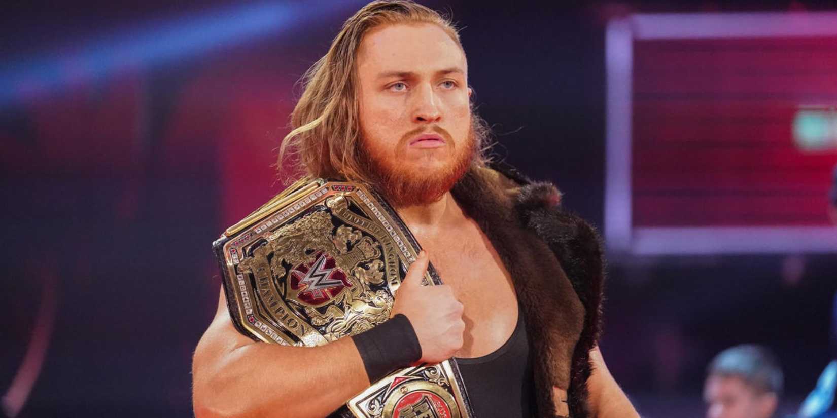Pete Dunne holding the WWE United Kingdom Championship