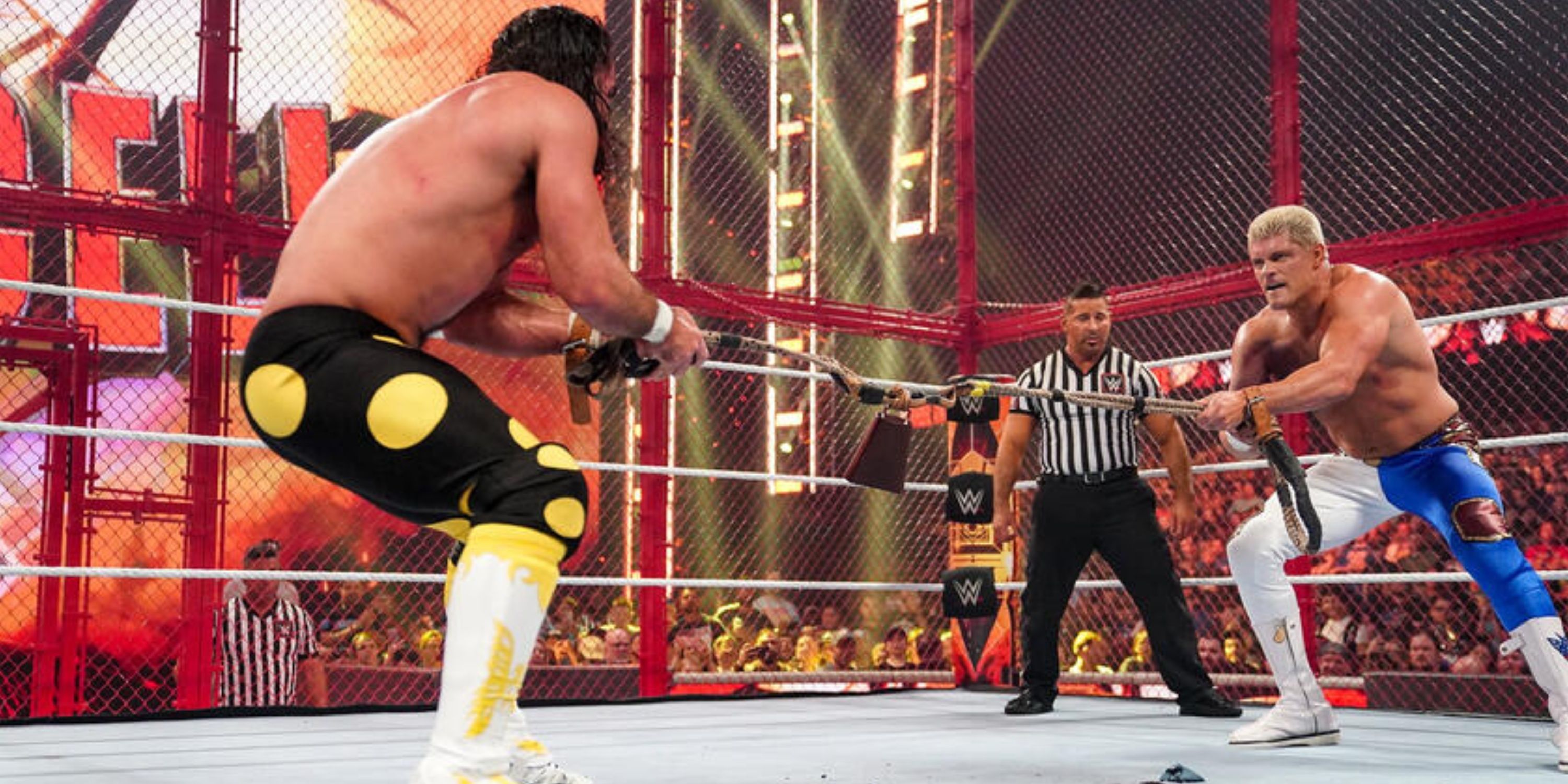 Seth Rollins and Cody Rhodes tussle over a bullrope inside Hell in a Cell