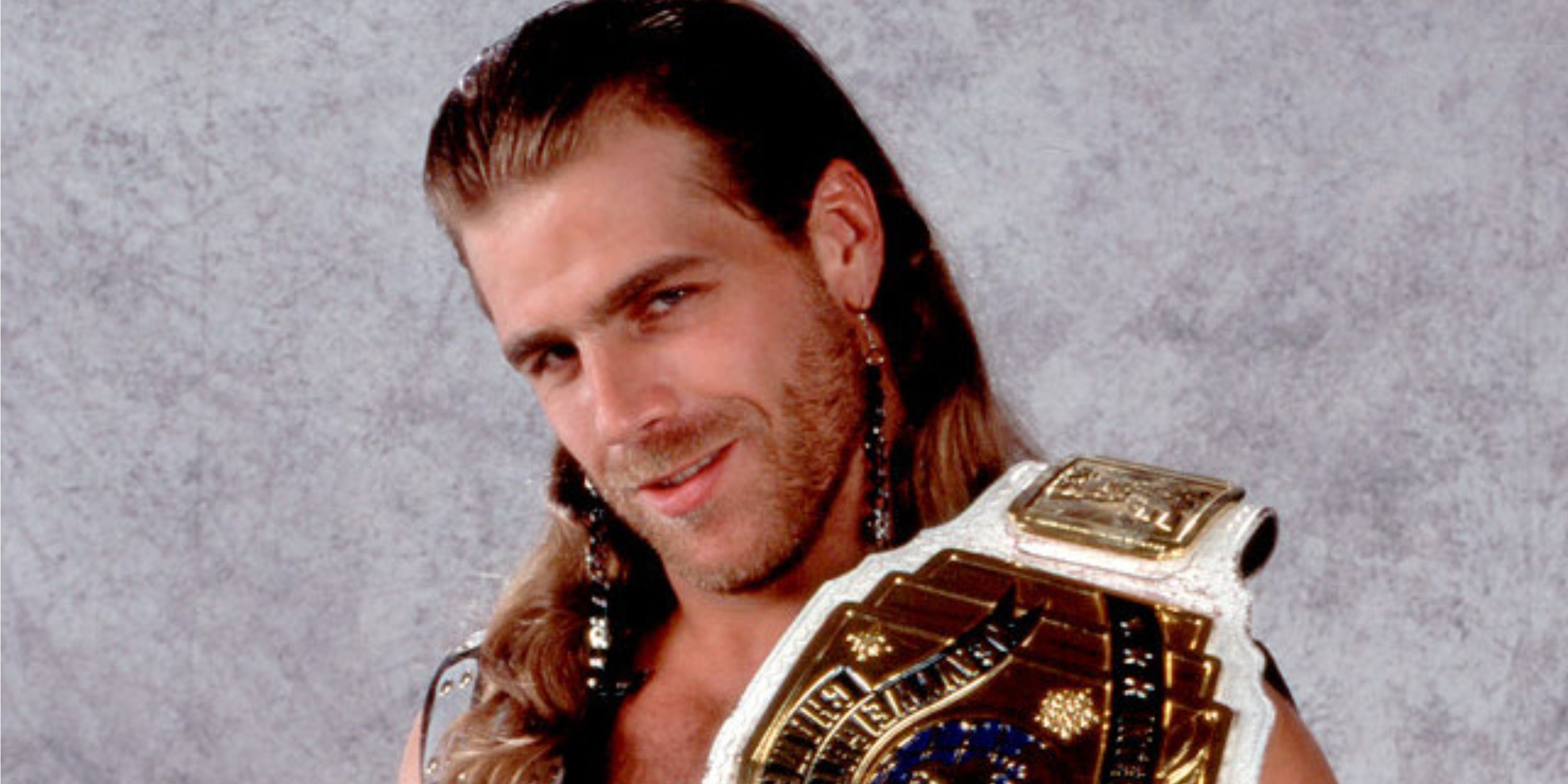 Shawn Michaels holding the WWE Intercontinental Championship