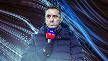 Gary Neville holding Sky Sports microphone