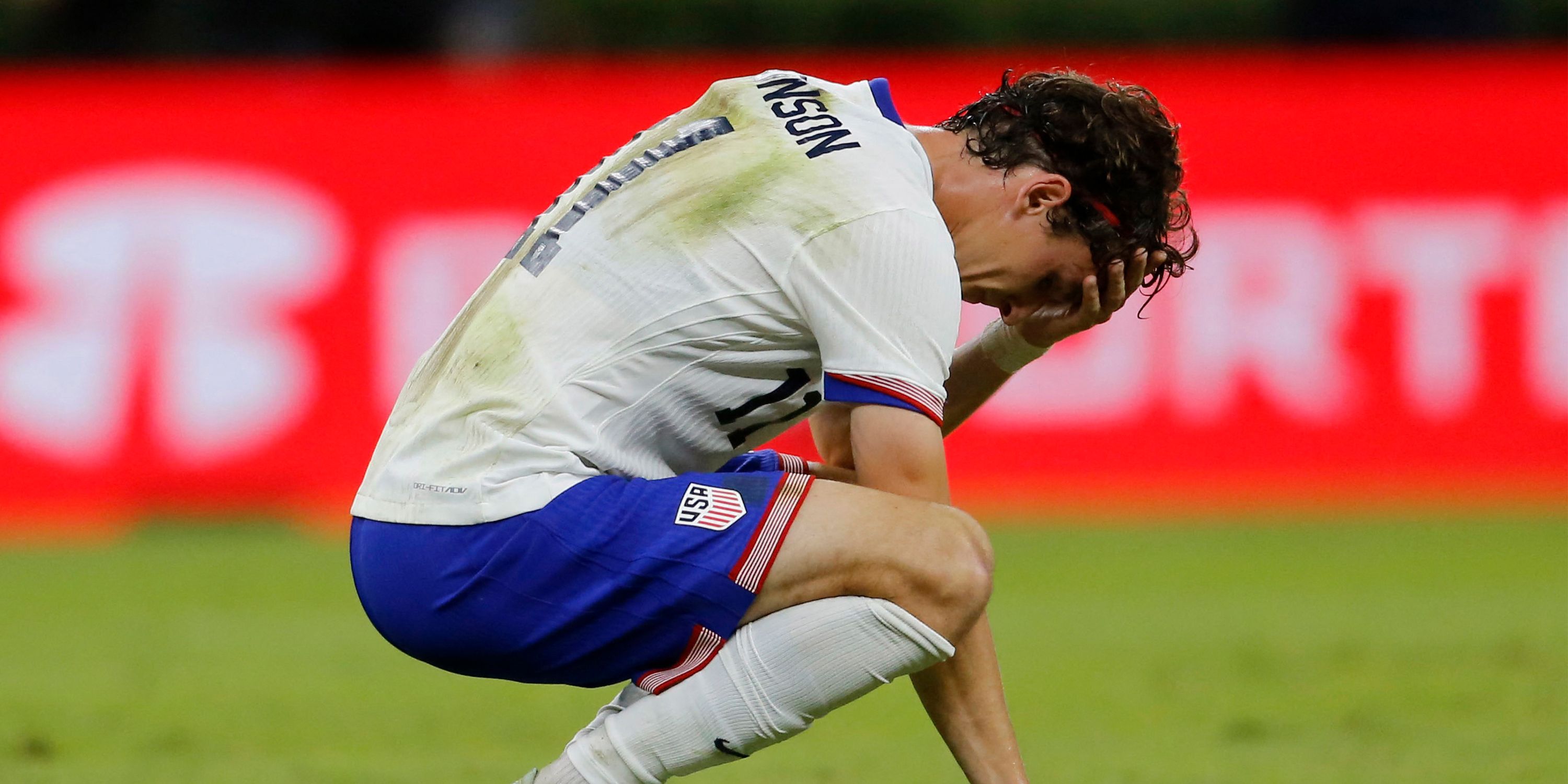 USMNT midfielder Brenden Aaronson reacts to conceding a goal against Mexico