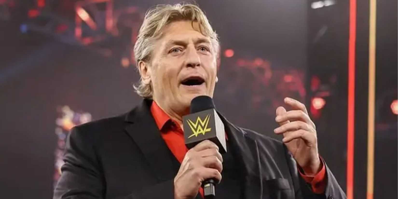 William Regal talking into a microphone at WWE NXT