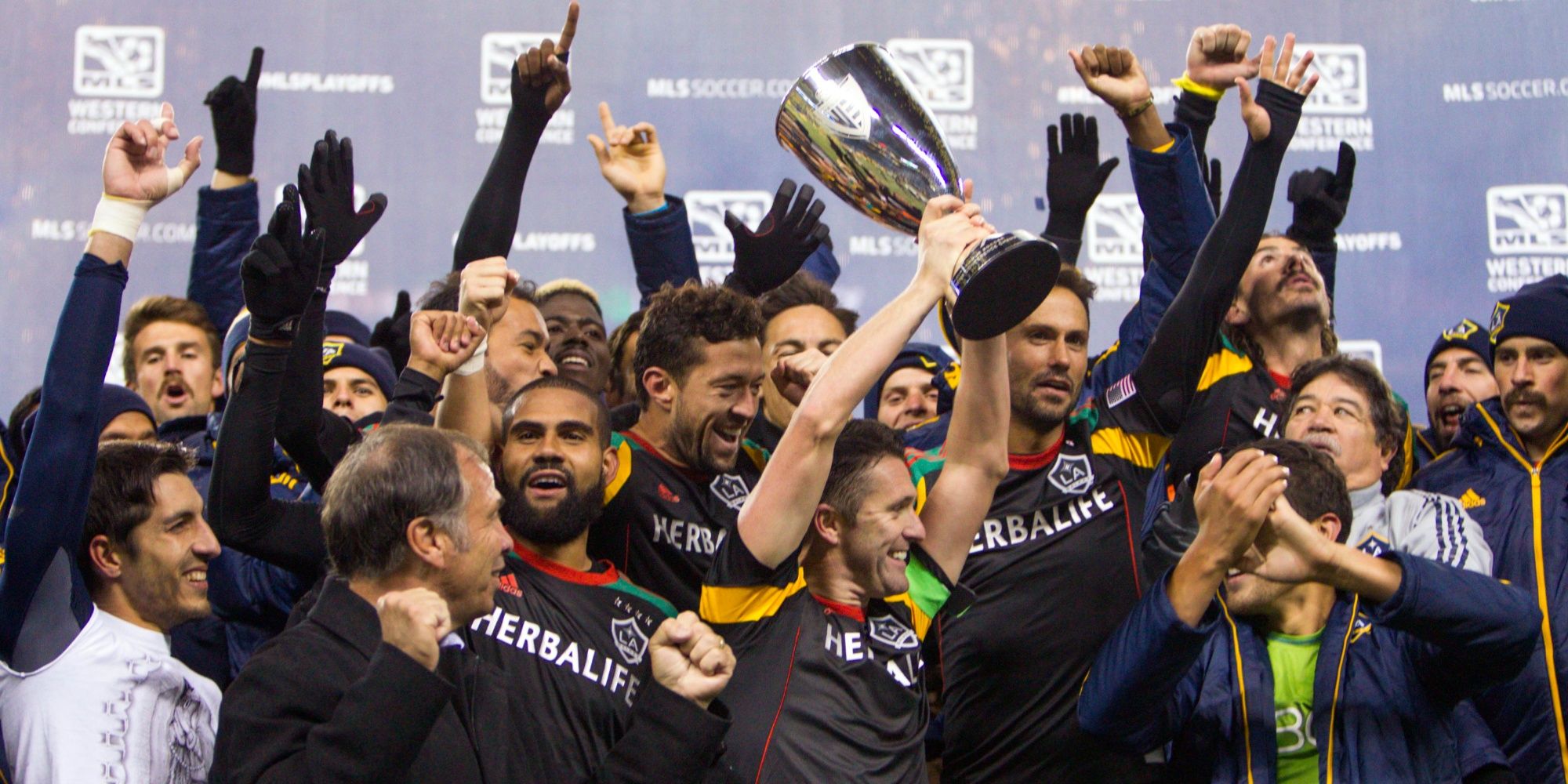 The Los Angeles Galaxy celebrate their victory over the Seattle Sounders FC for the Western Conference Championship at CenturyLink Field