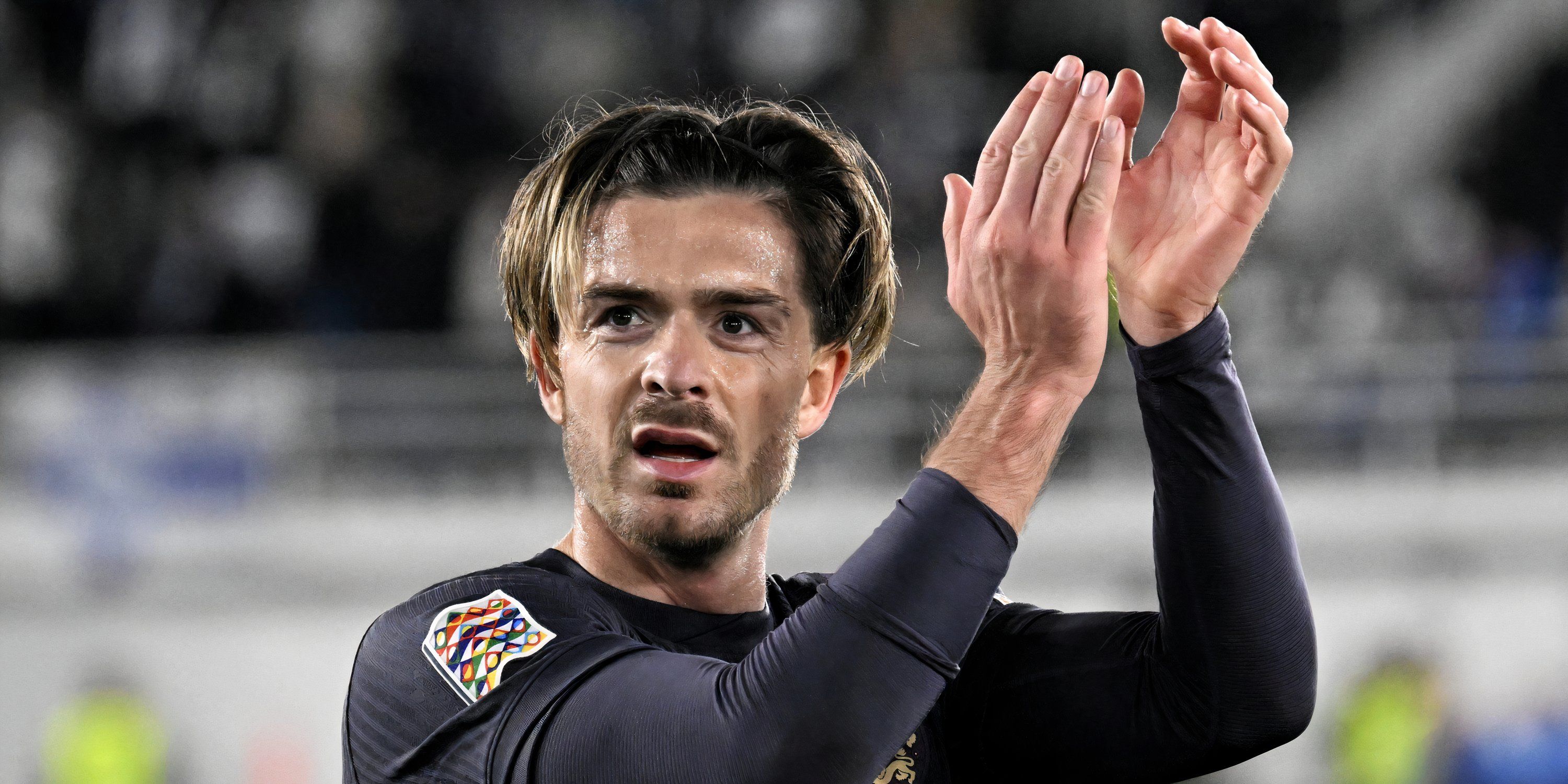 England winger Jack Grealish applauding the supporters