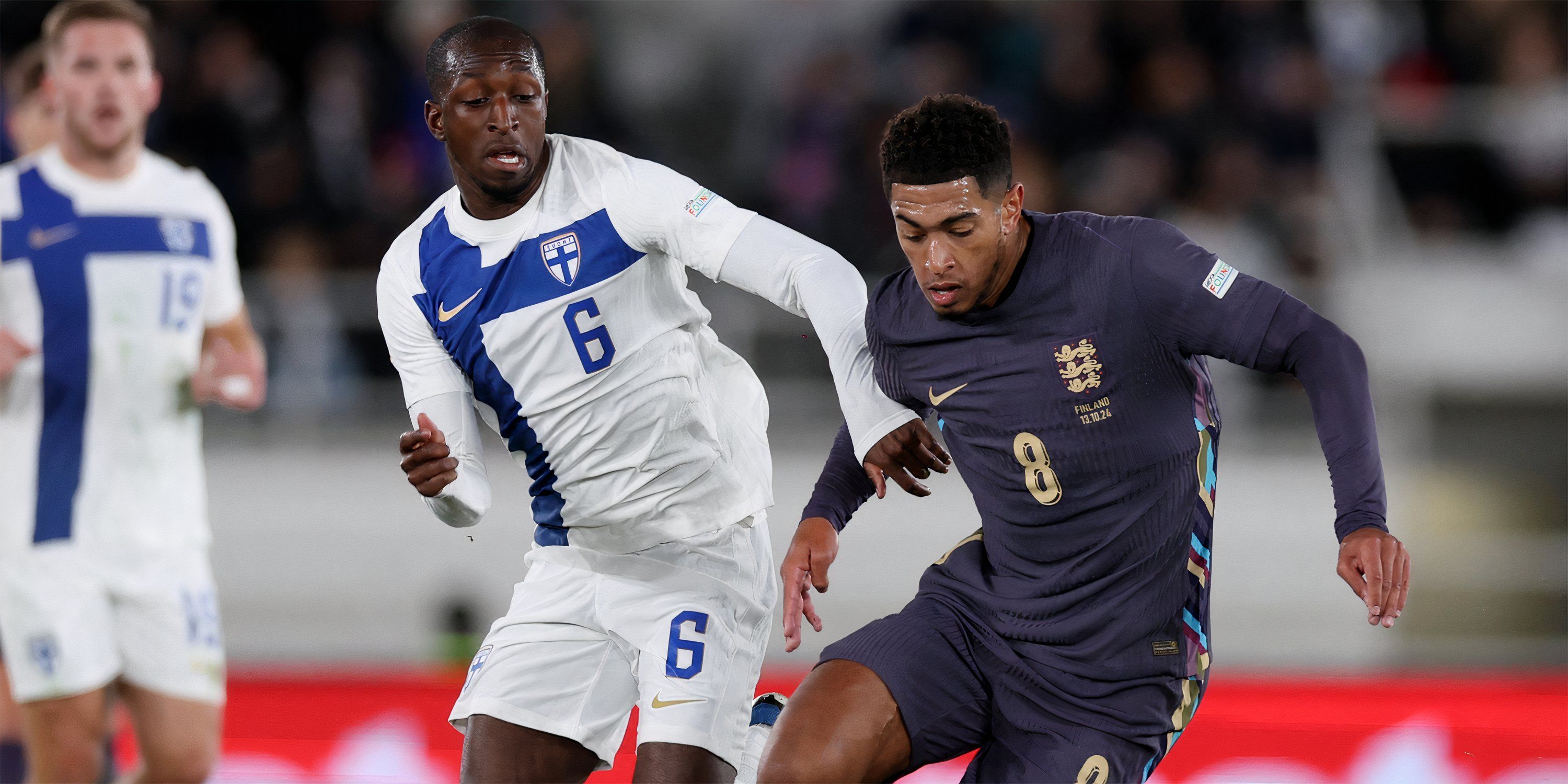 Finland midfielder Glen Kamara battling with England playmaker Jude Bellingham for possession