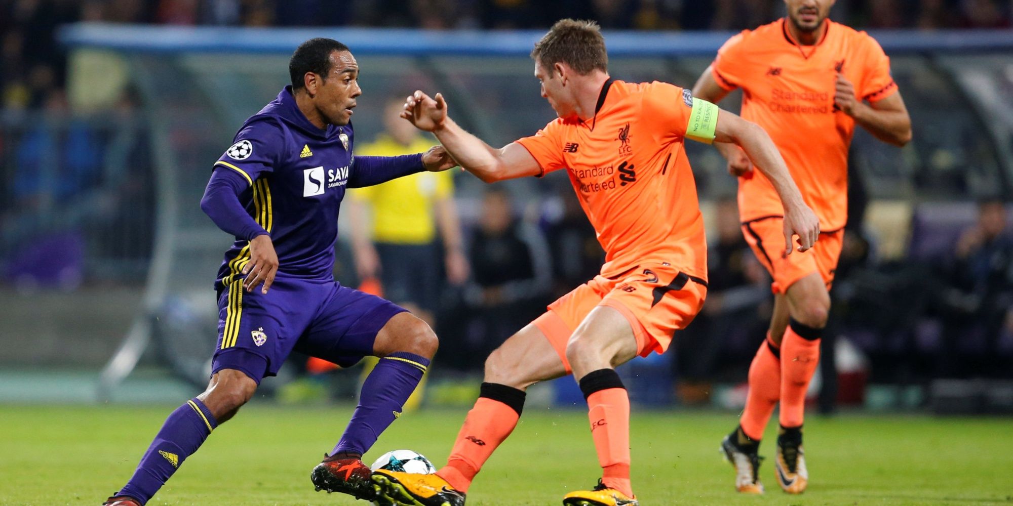 NK Maribor's Marcos Tavares in action with Liverpool's James Milner