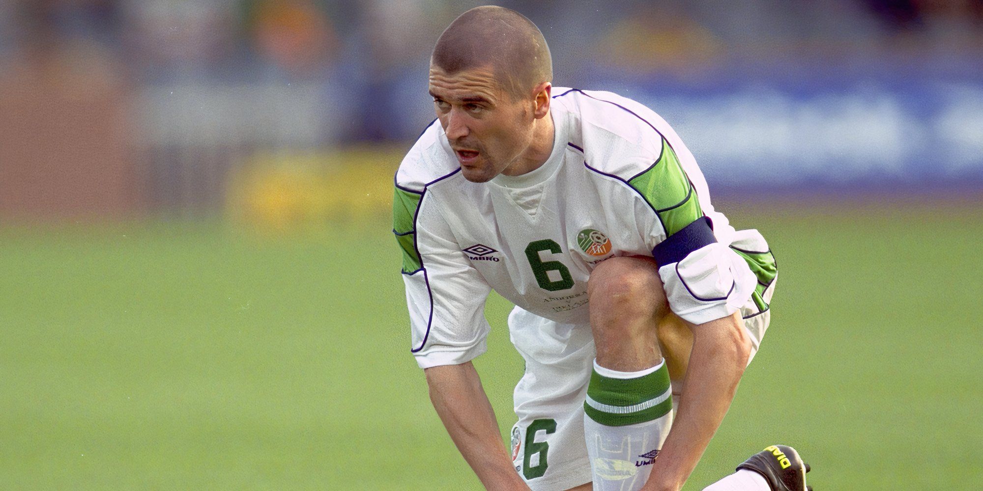 Roy Keane ties up his boots playing for Ireland