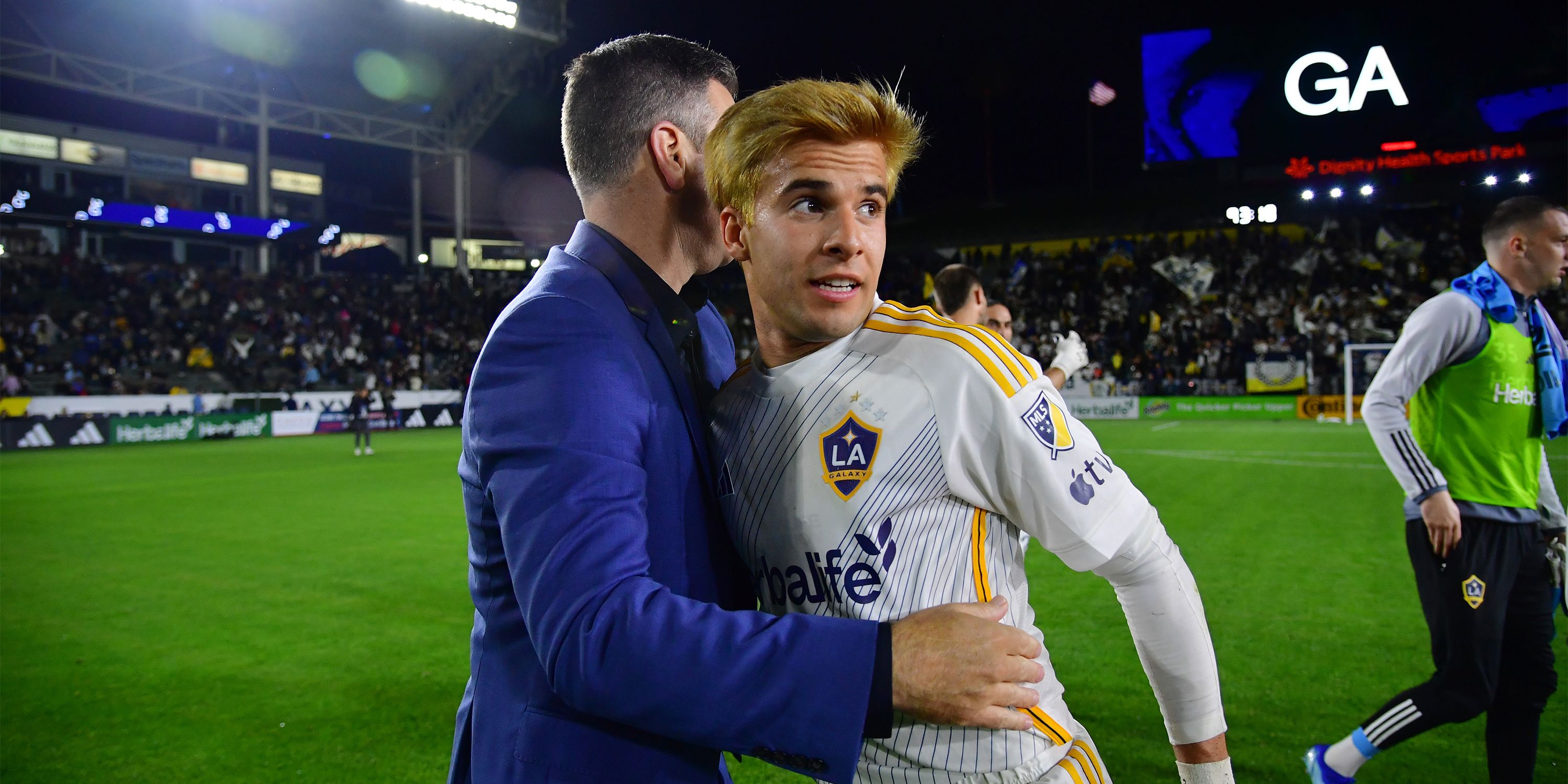 LA Galaxy head coach Greg Vanney embraces midfielder Riqui Puig