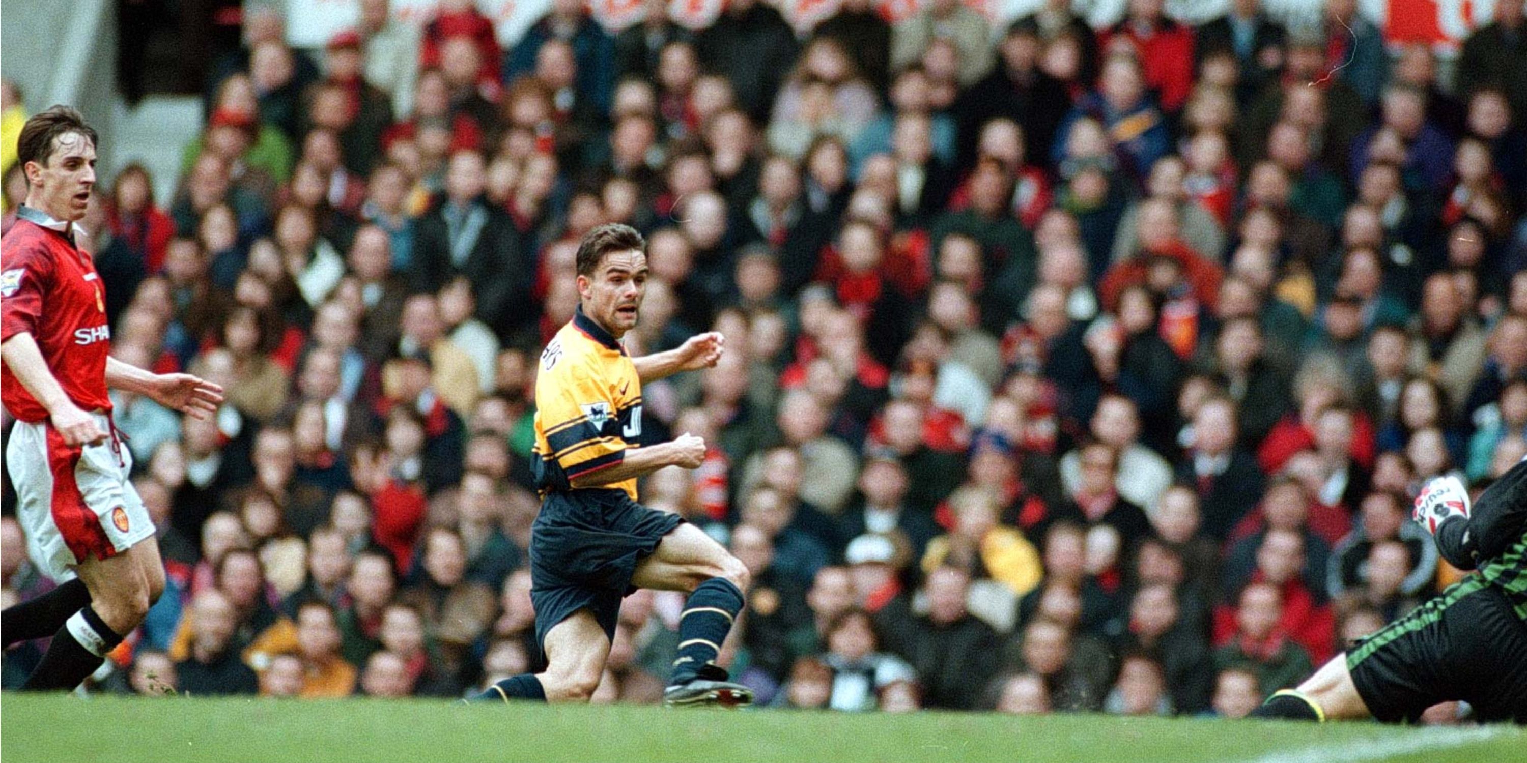 Marc Overmars scores at Old Trafford