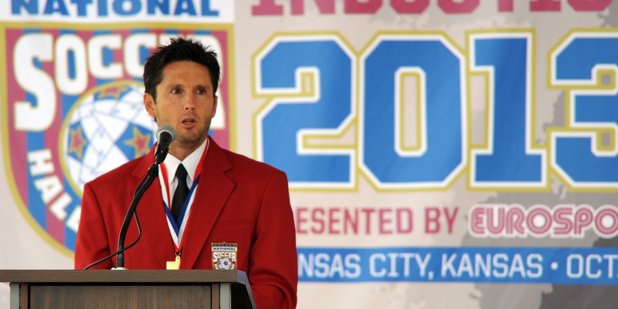 USMT former player Joe Max Moore speaks during the National Soccer Hall of Fame induction