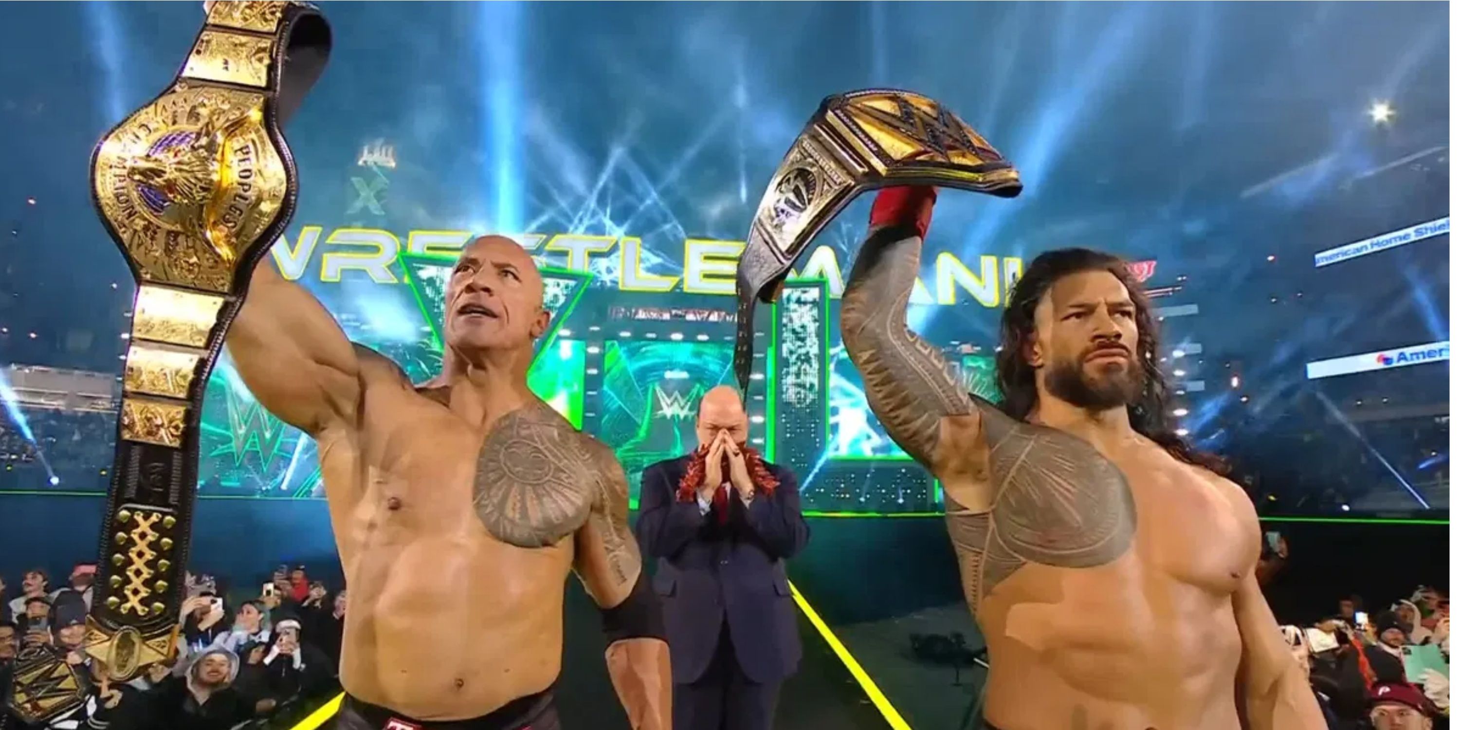The Rock with theThe People's Championship and Roman Reigns