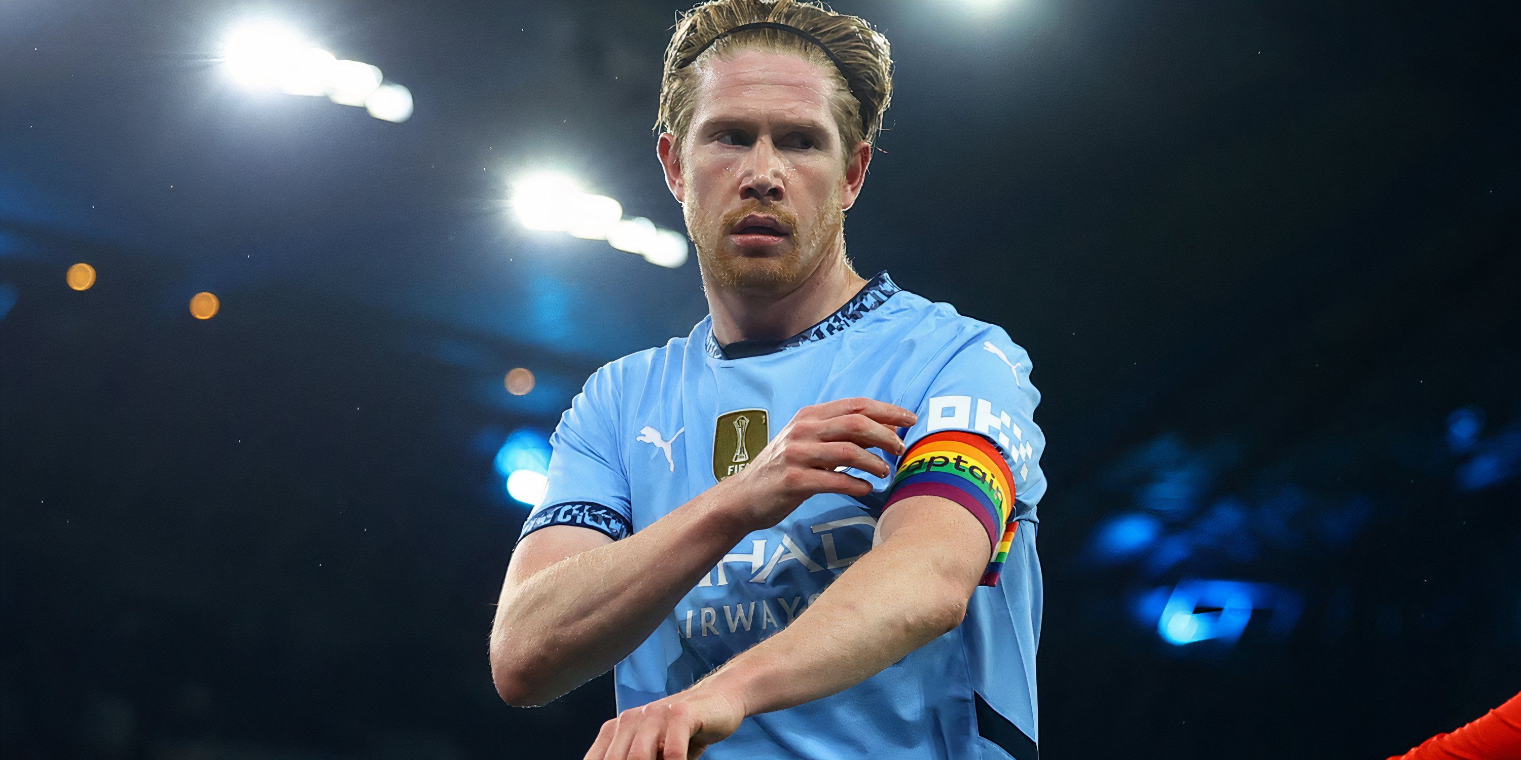 Manchester City playmaker Kevin De Bruyne adjusts his captain's armband