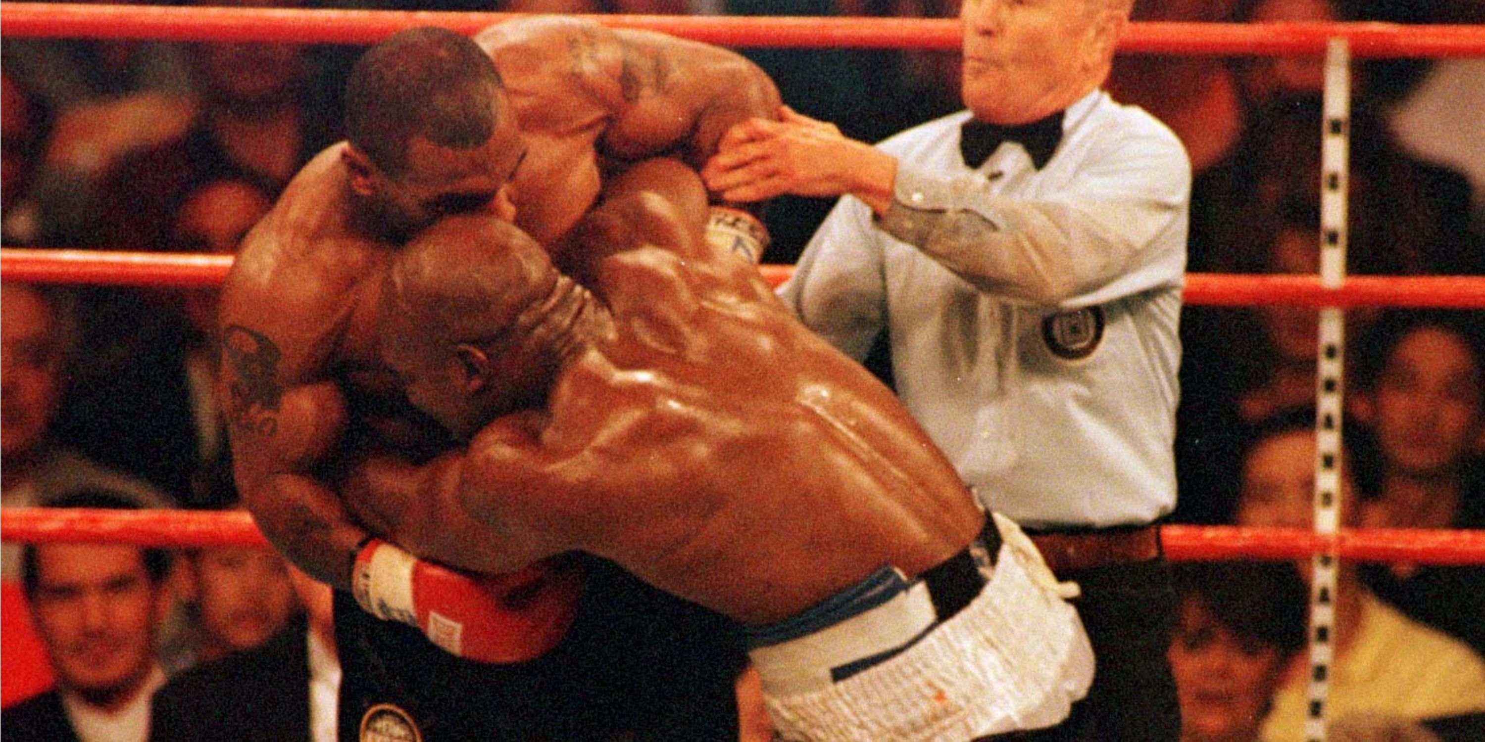 Mike Tyson biting Evander Holyfield's ear