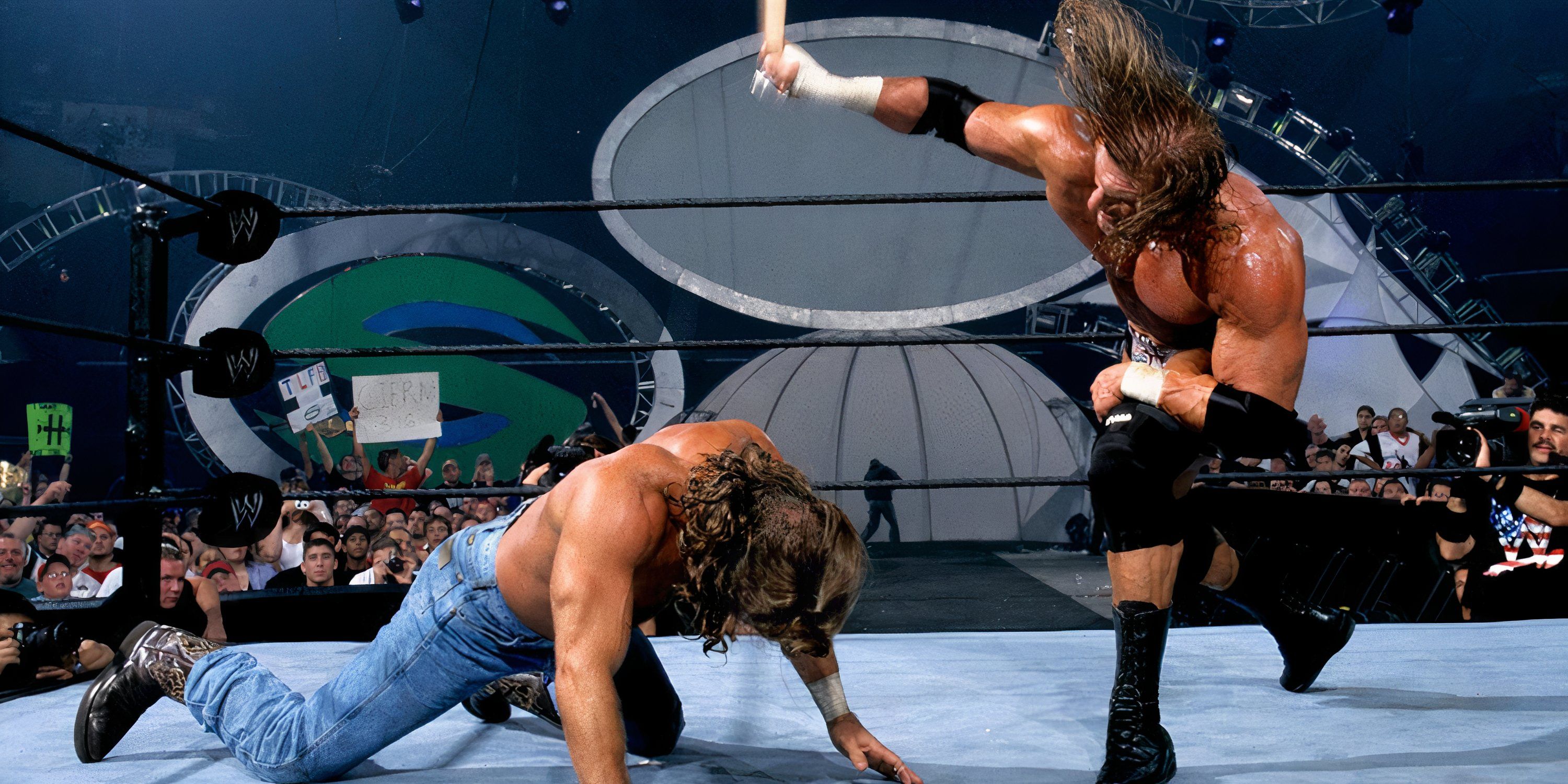 Triple H whips opponent Shawn Michaels with a belt at SummerSlam 2002.