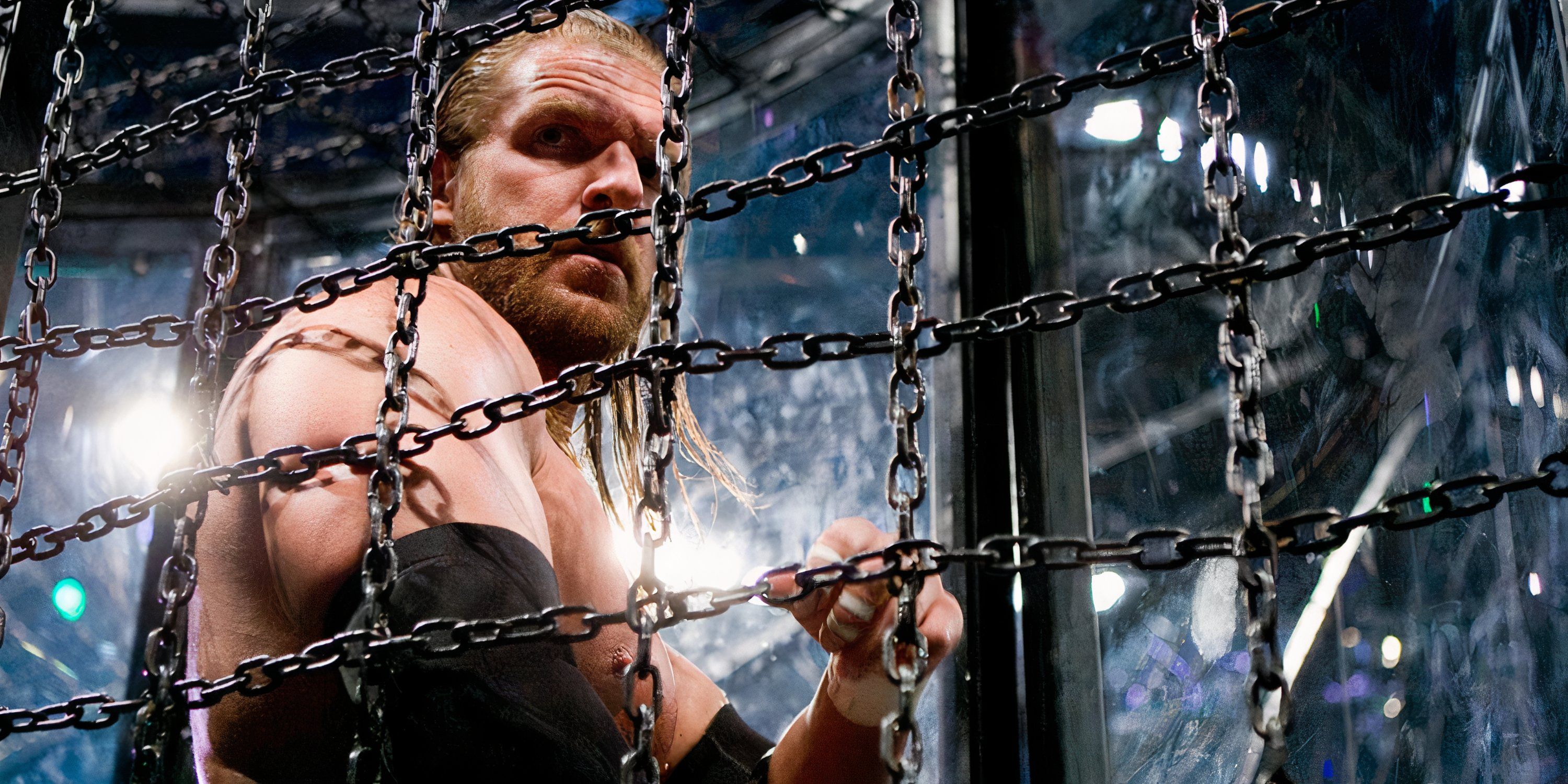 Triple H looks on inside his Elimination Chamber pod.