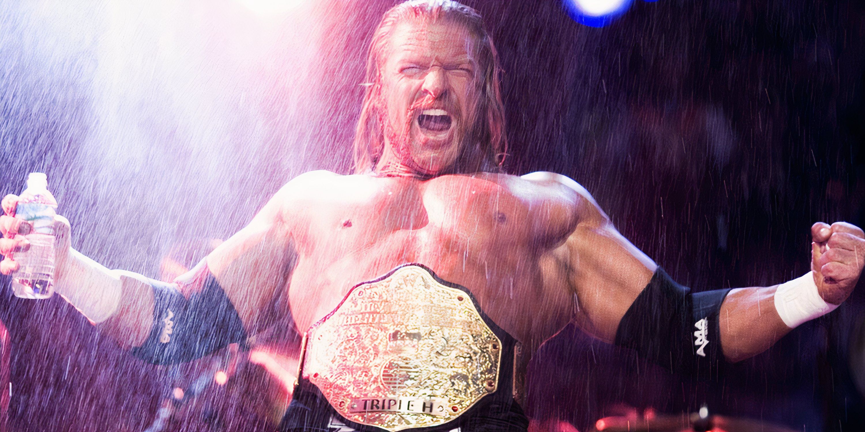 Triple H poses with the World Heavyweight Championship.