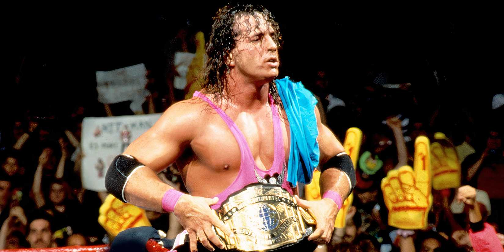 Bret Hart poses with the Intercontinental Championship after a match.