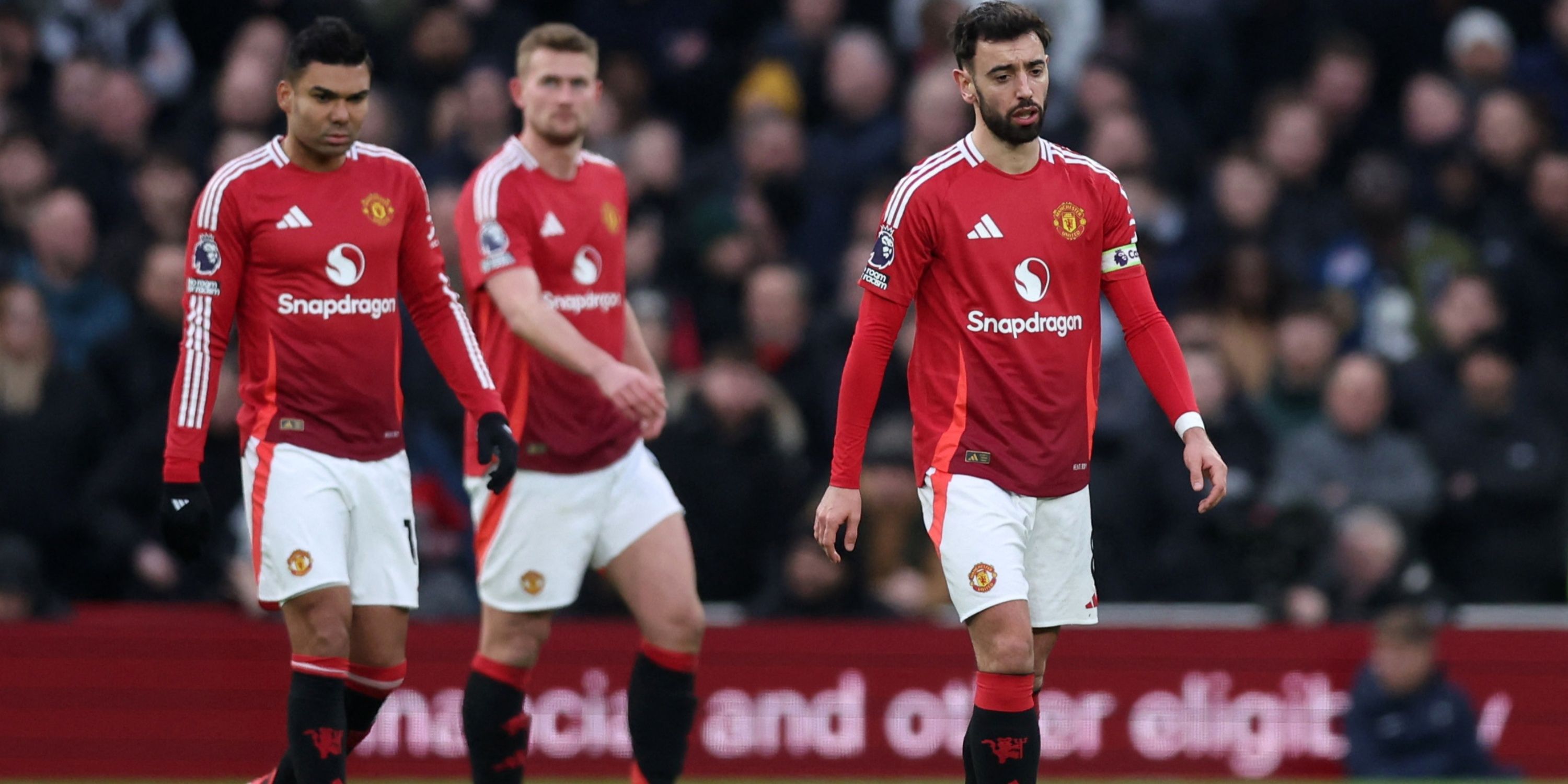 Manchester United players looking down