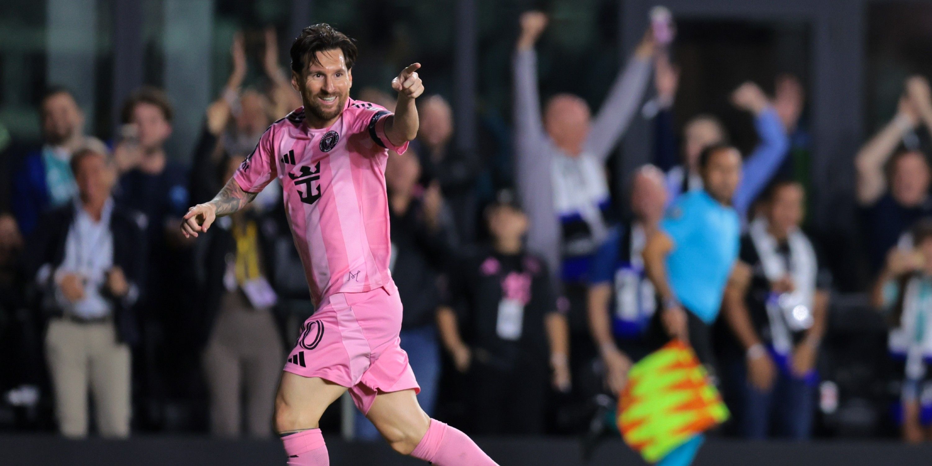 Lionel Messi points after scoring against Sporting Kansas City