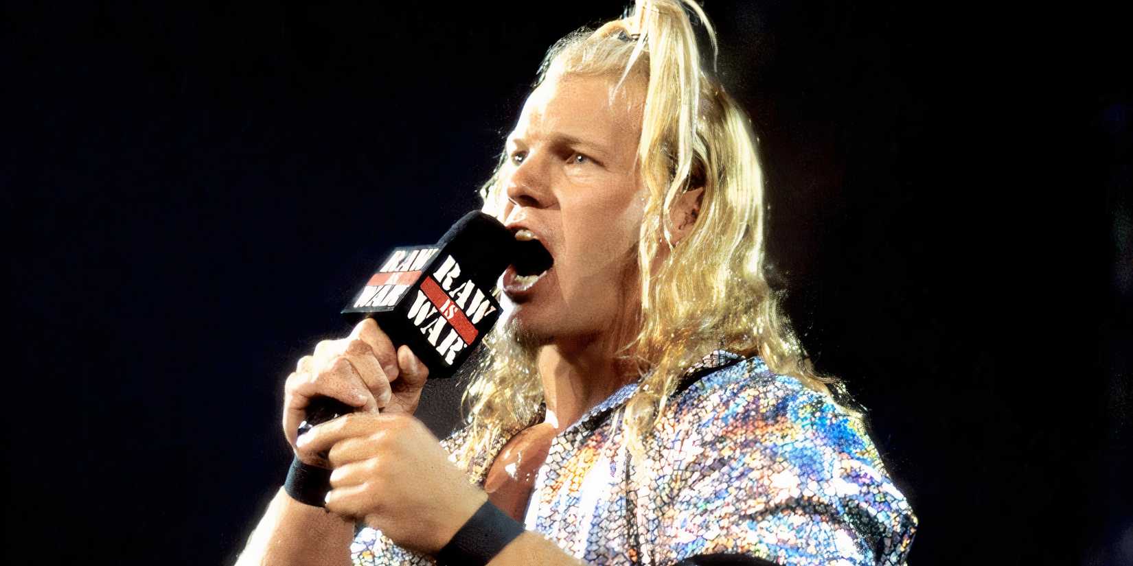 Chris Jericho speaks into a microphone on an episode of RAW during the Attitude Era.