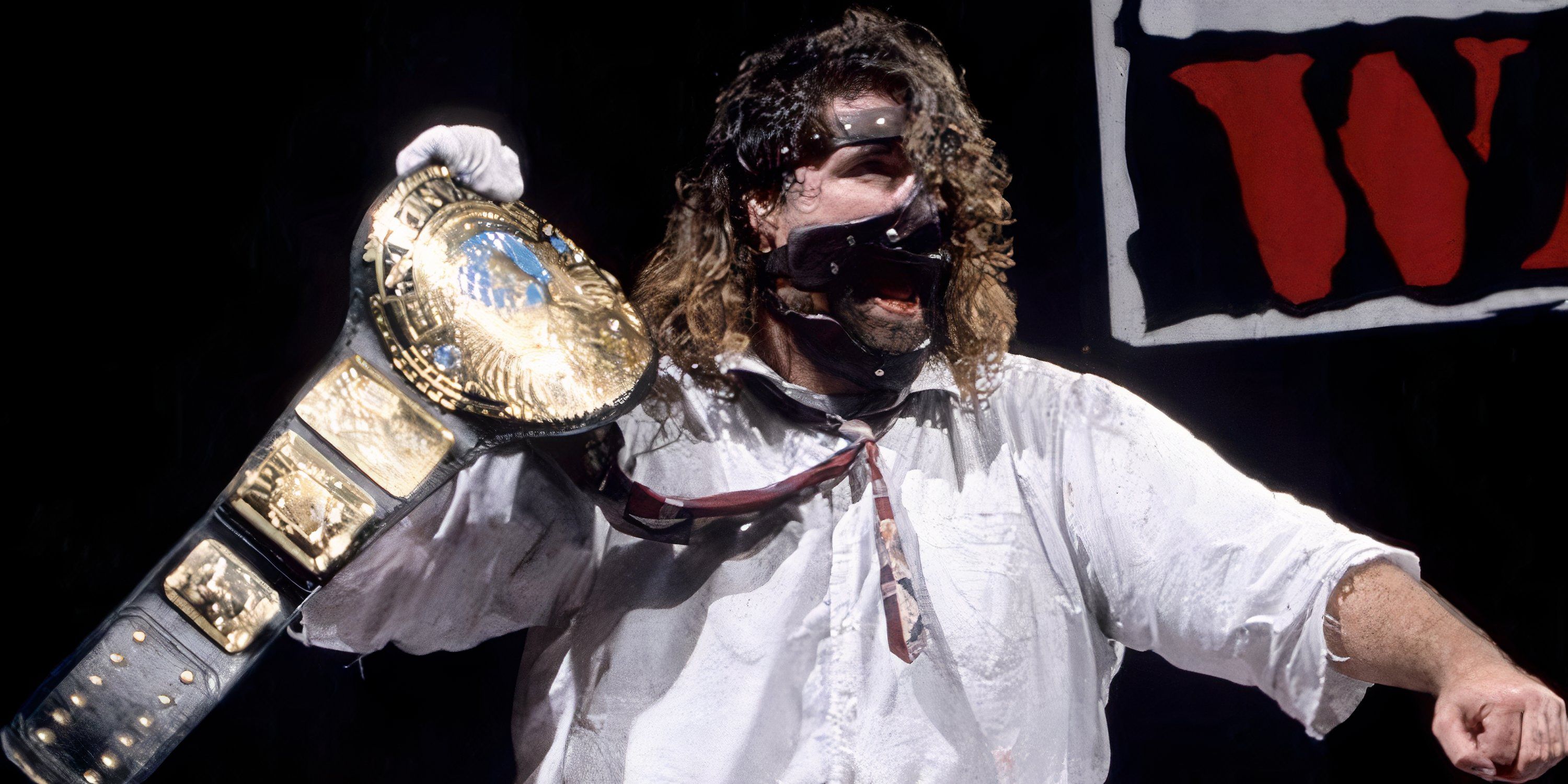 Mick Foley poses, as Mankind, with the WWF Championship during the Attitude Era.