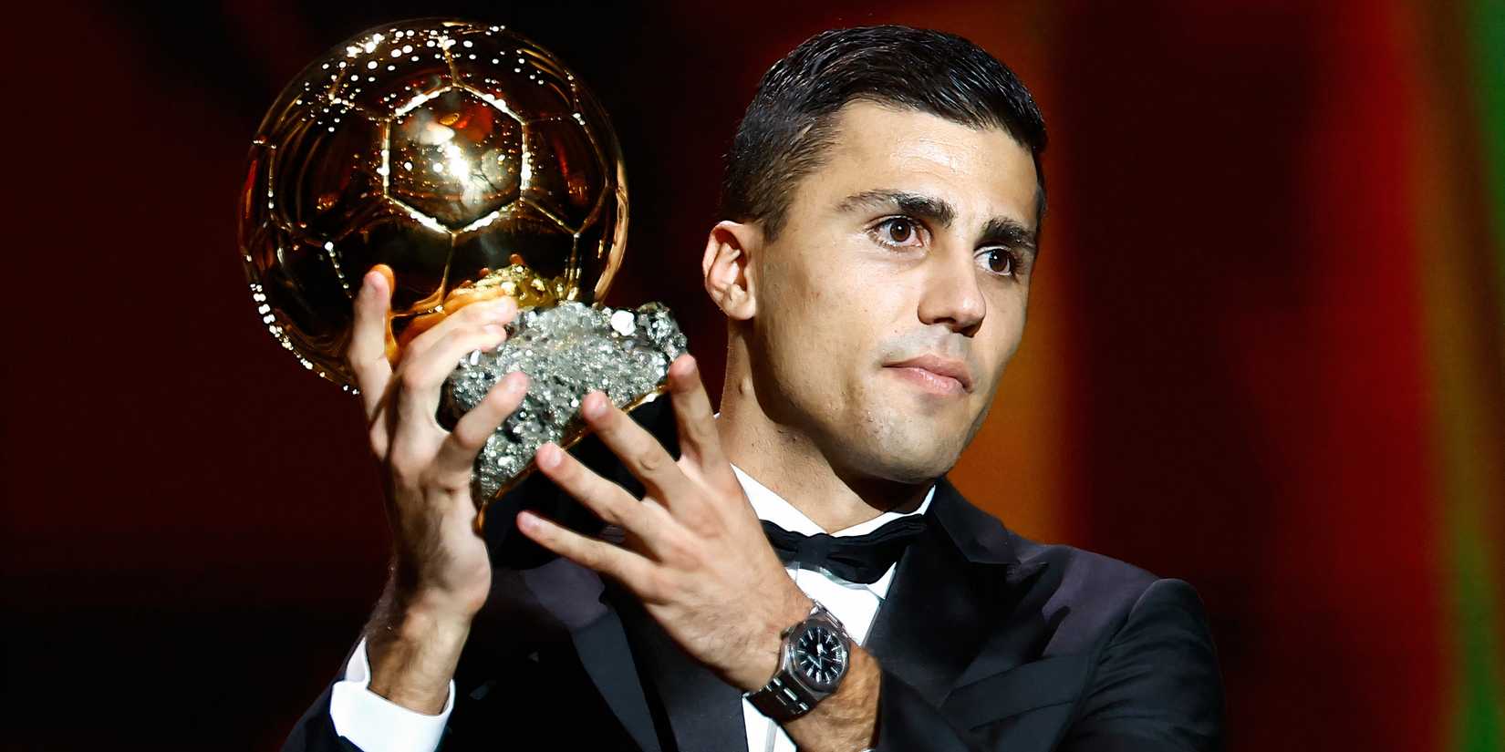 Manchester City defensive midfielder Rodri celebrating with the Ballon d'Or