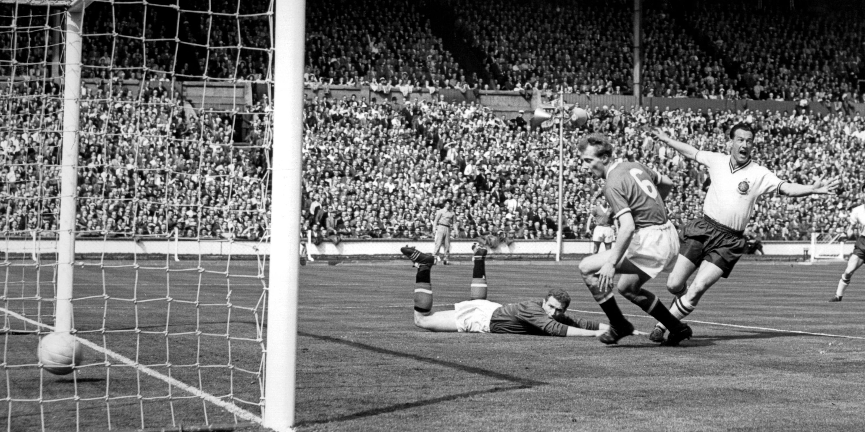 Nat Lofthouse celebrates after scoring the first goal for Bolton past Stan Crowther and goalkeeper Harry Gregg