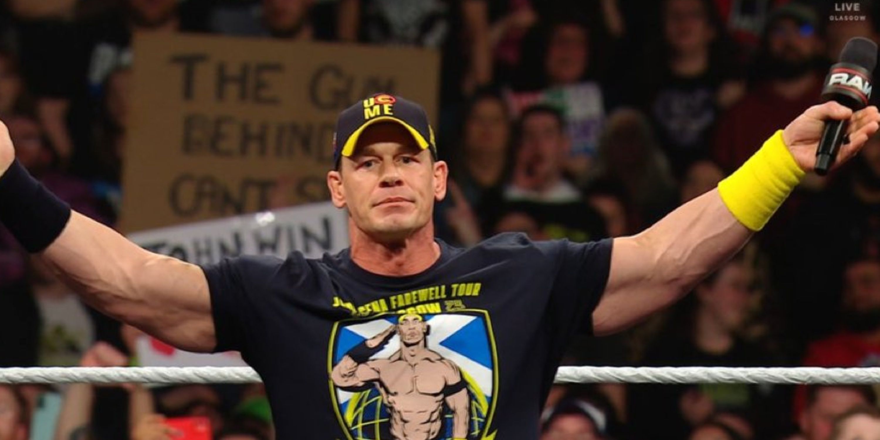 John Cena with his arms aside during WWE Raw.