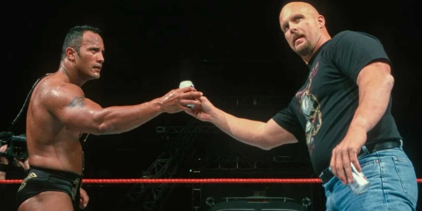 The Rock and Stone Cold toasting a beer at WWE Backlash 2000.