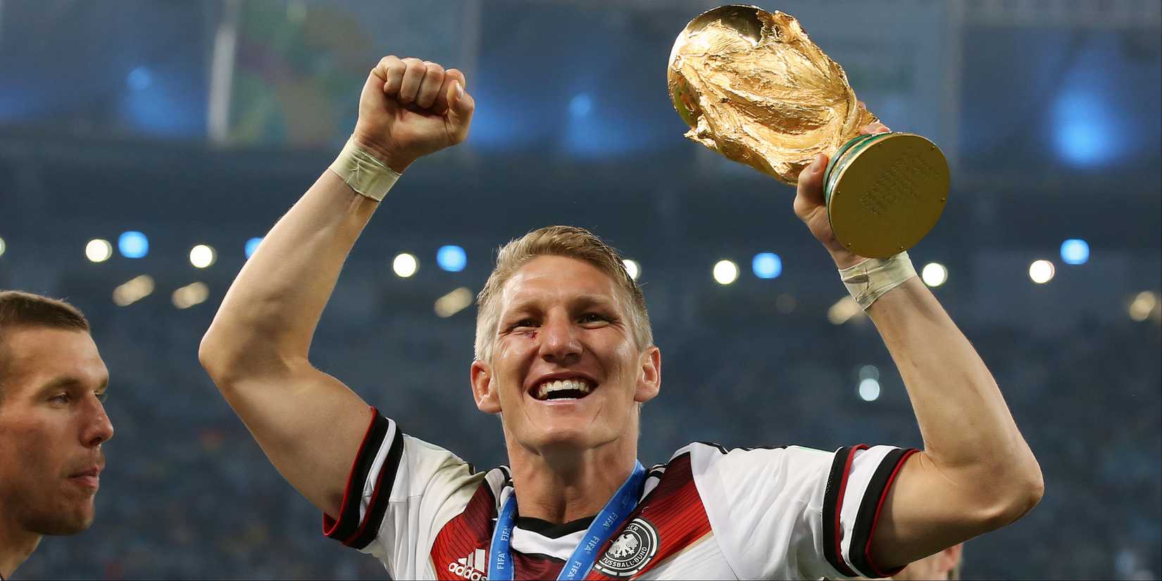 Bastian Schweinsteiger celebrates winning the World Cup