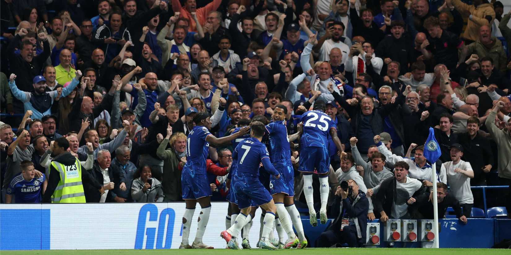 Chelsea players and fans celebrating together