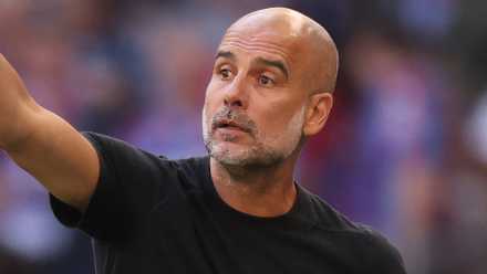 Manchester City manager Pep Guardiola pointing