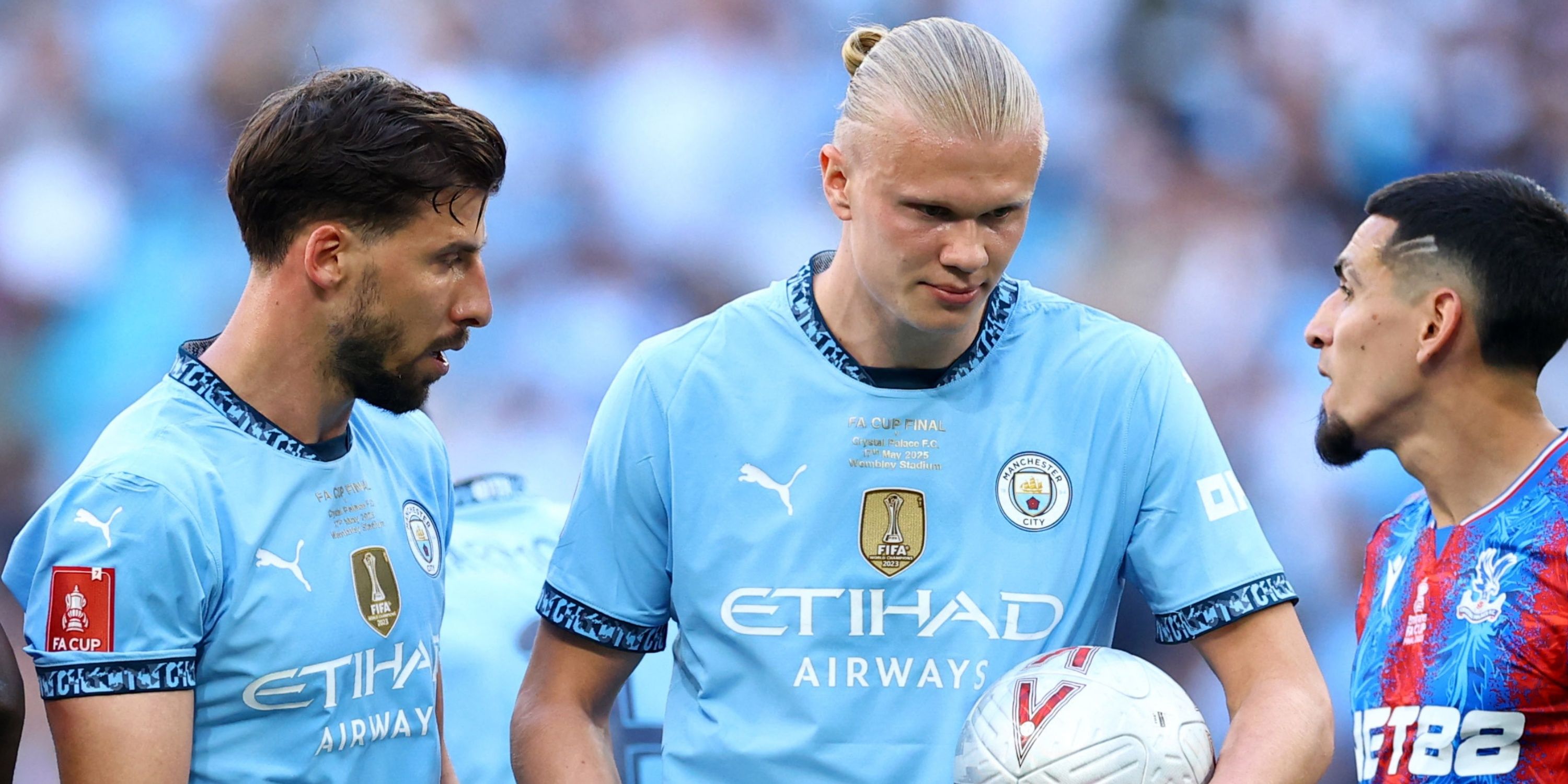 Manchester City's Ruben Dias and Erling Haaland after a penalty is awarded