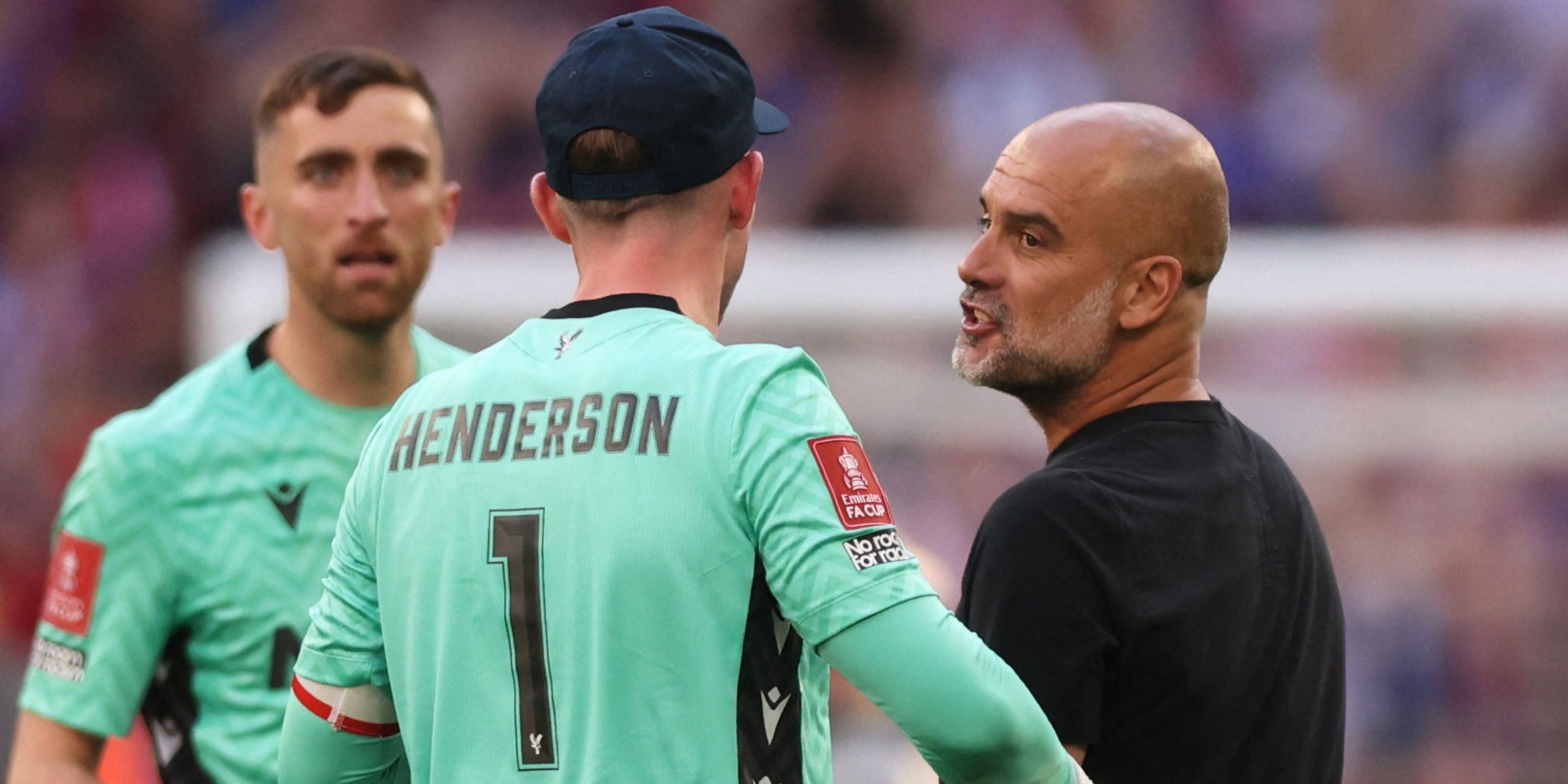 Manchester City manager Pep Guardiola with Crystal Palace's Dean Henderson after Crystal Palace won the FA Cup