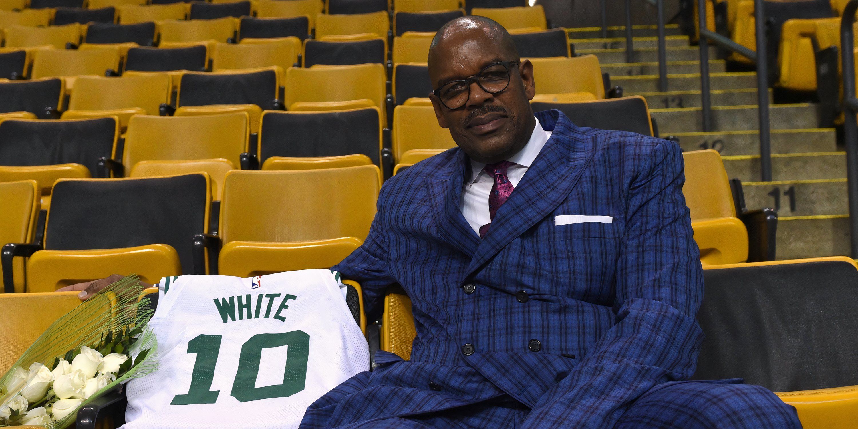 Cedric Maxwell sitting down in tribute to his former teammate Jo Jo White