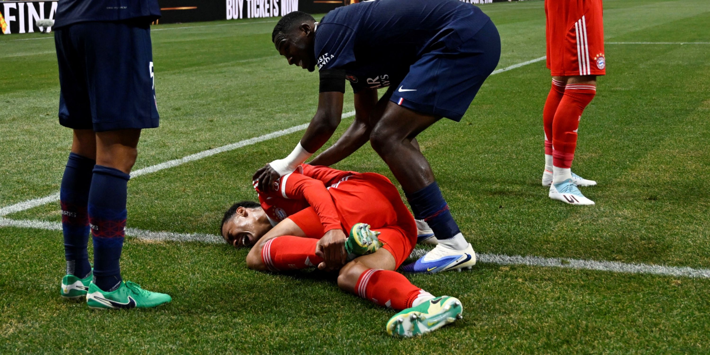 Bayern Munich's Jamal Musiala sustains an injury after a collision with Paris St Germain's Gianluigi Donnarumma
