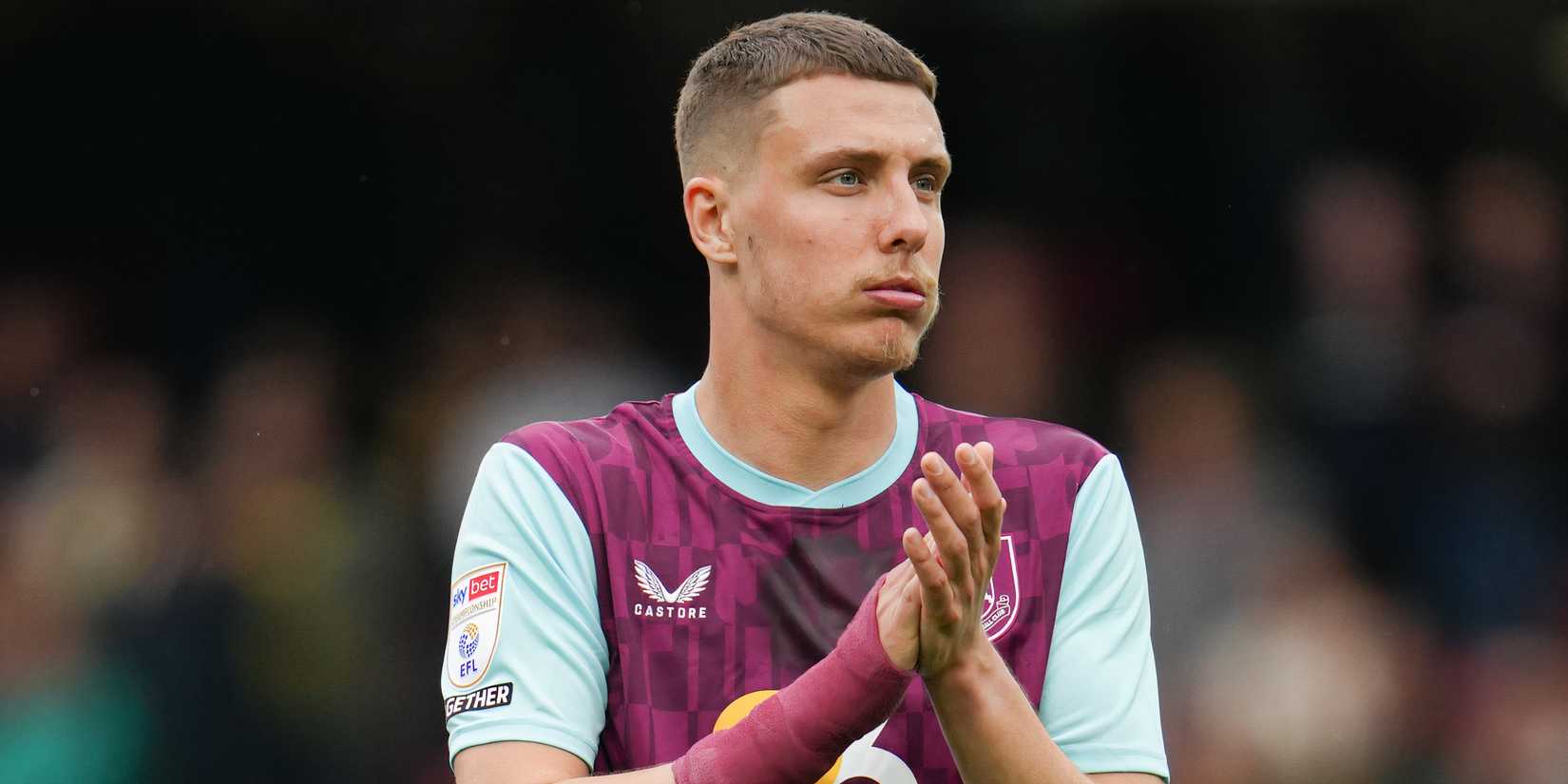 Maxime Esteve applauding the Burnley supporters