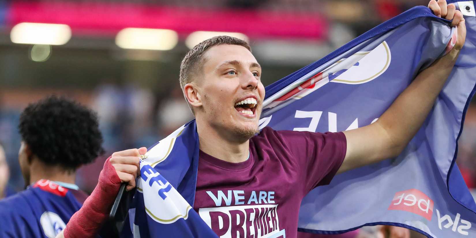 Burnley defender Maxime Esteve celebrating after sealing promotion