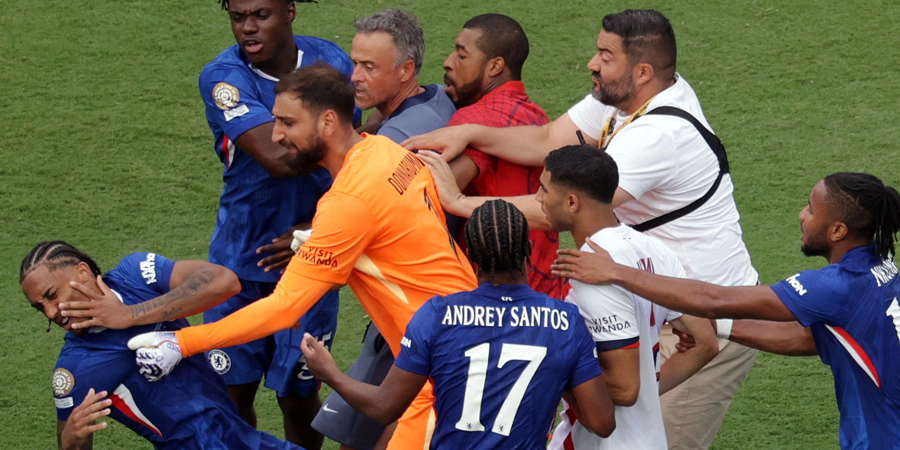 Chelsea's Joao Pedro clashes with Paris St Germain's Gianluigi Donnarumma as Paris St Germain coach Luis Enrique looks on