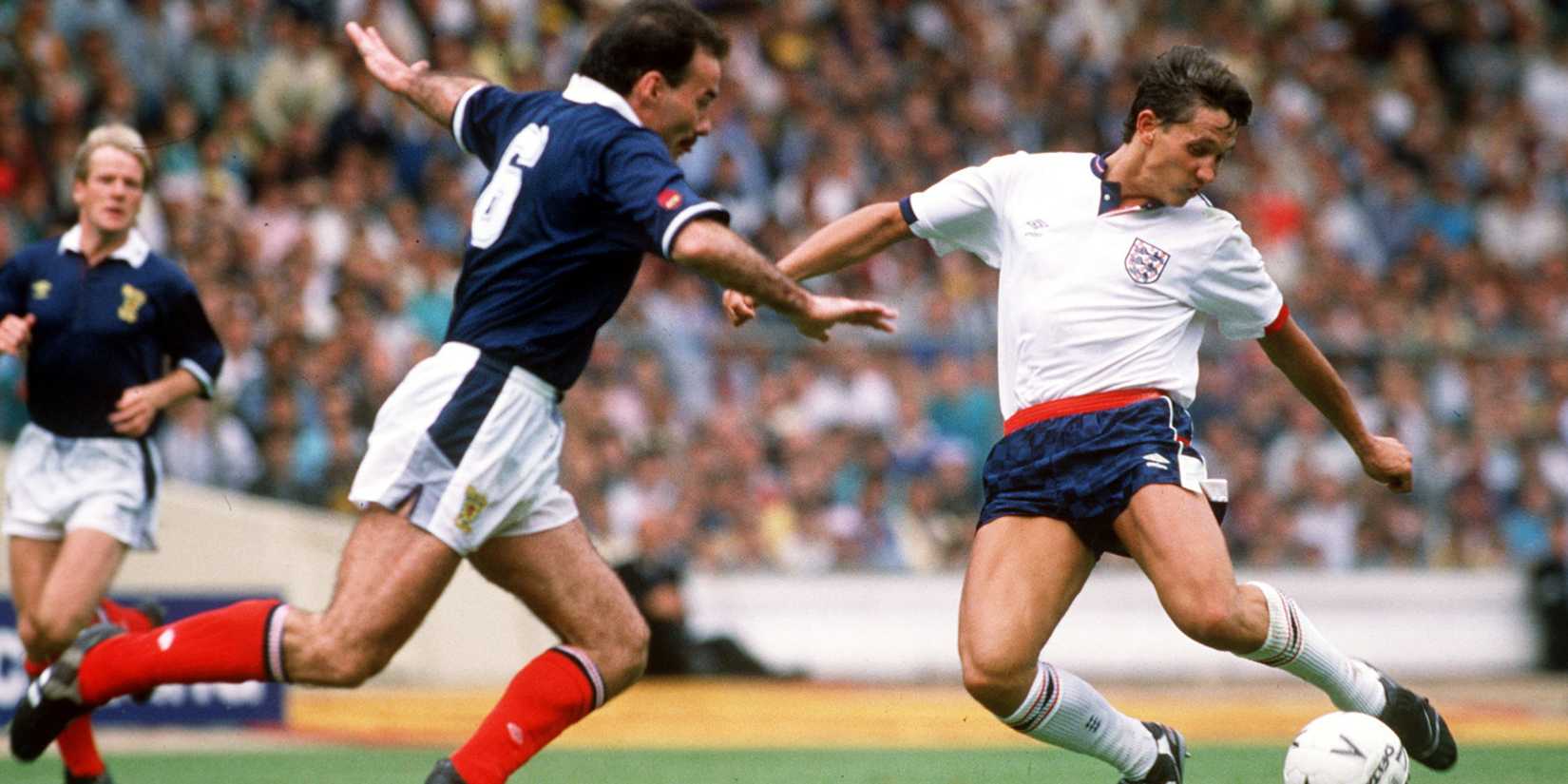 England's Gary Lineker shoots past Willie Miller of Scotland