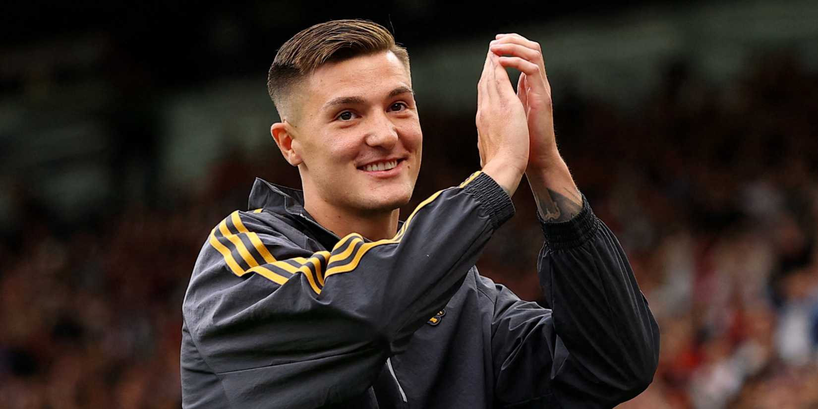 Manchester United striker Benjamin Sesko applauds fans after completing move to Old Trafford