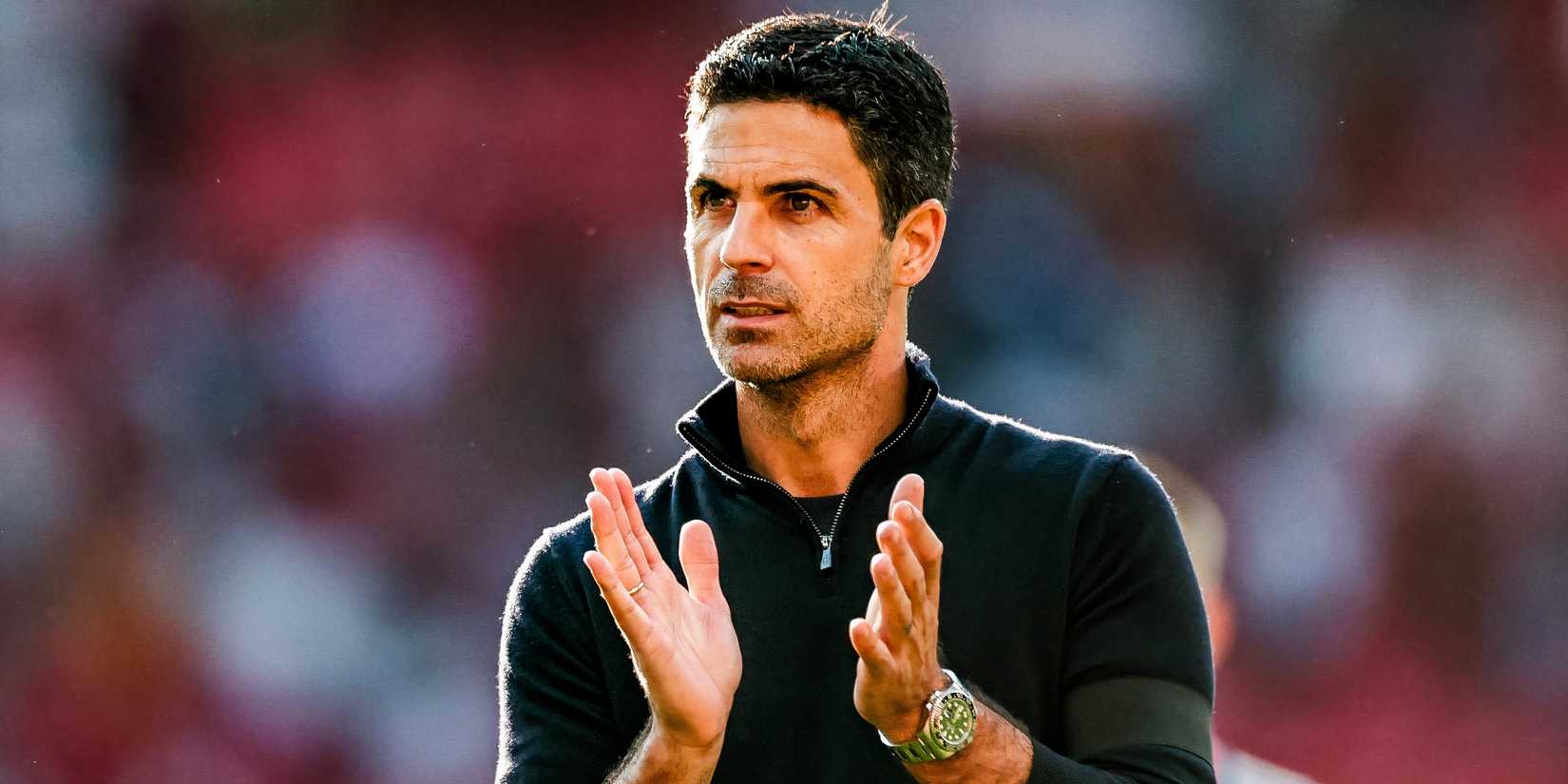 Arsenal boss Mikel Arteta applauding the supporters