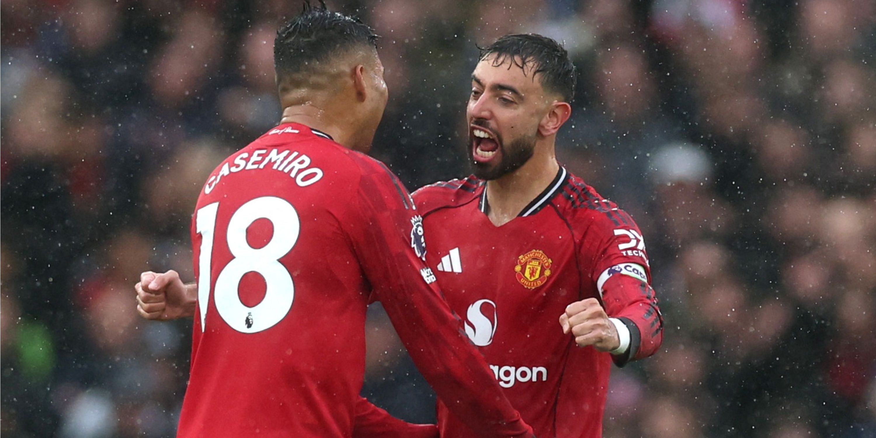 Bruno Fernandes and Casemiro embracing after Manchester United score against Chelsea