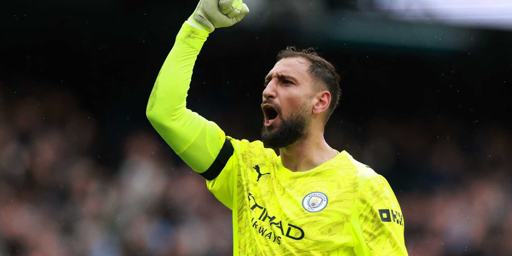 Gianluigi Donnarumma celebrating after Manchester City scored against Manchester United