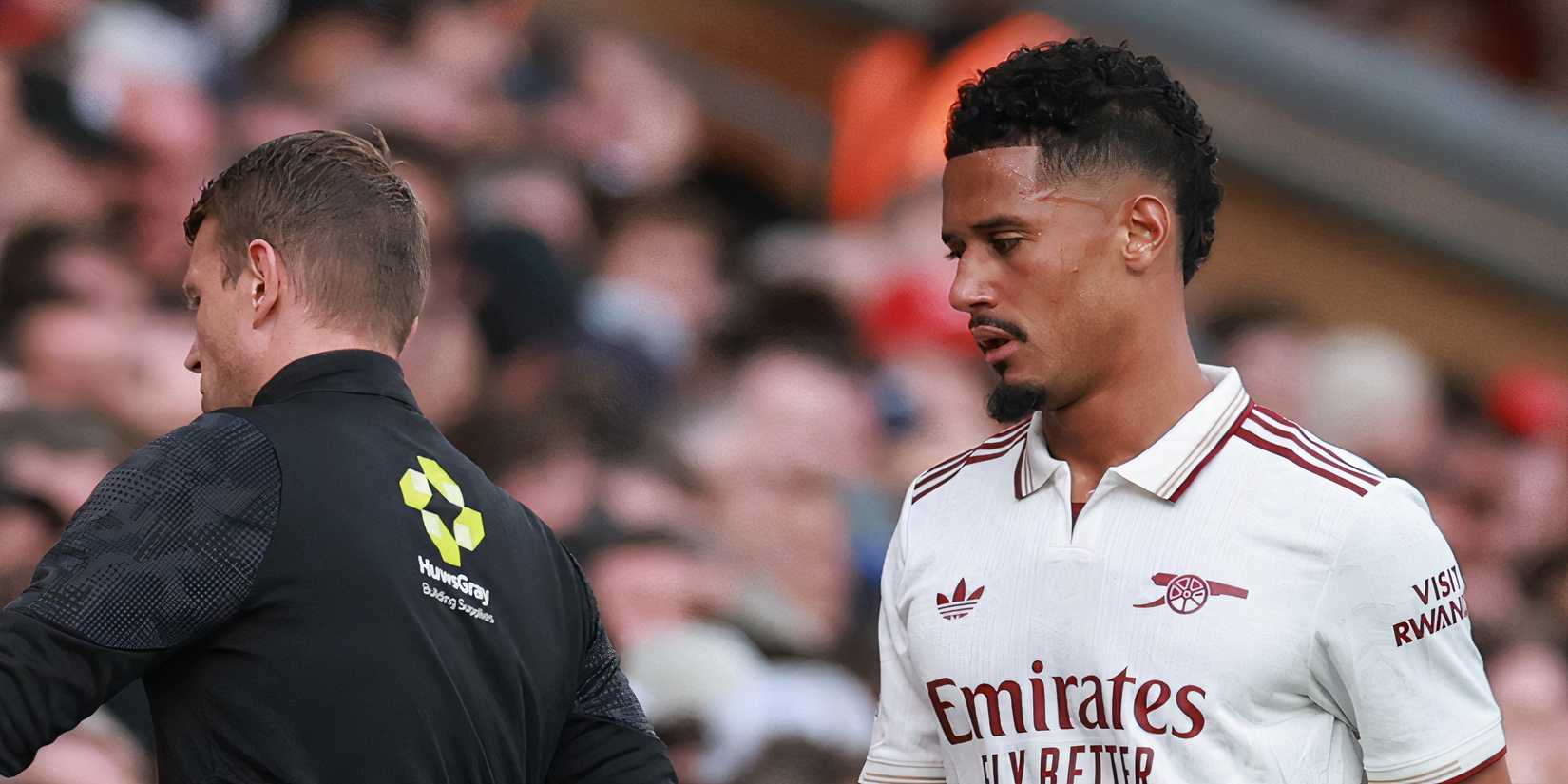 Arsenal's William Saliba walks off the pitch after sustaining an injury